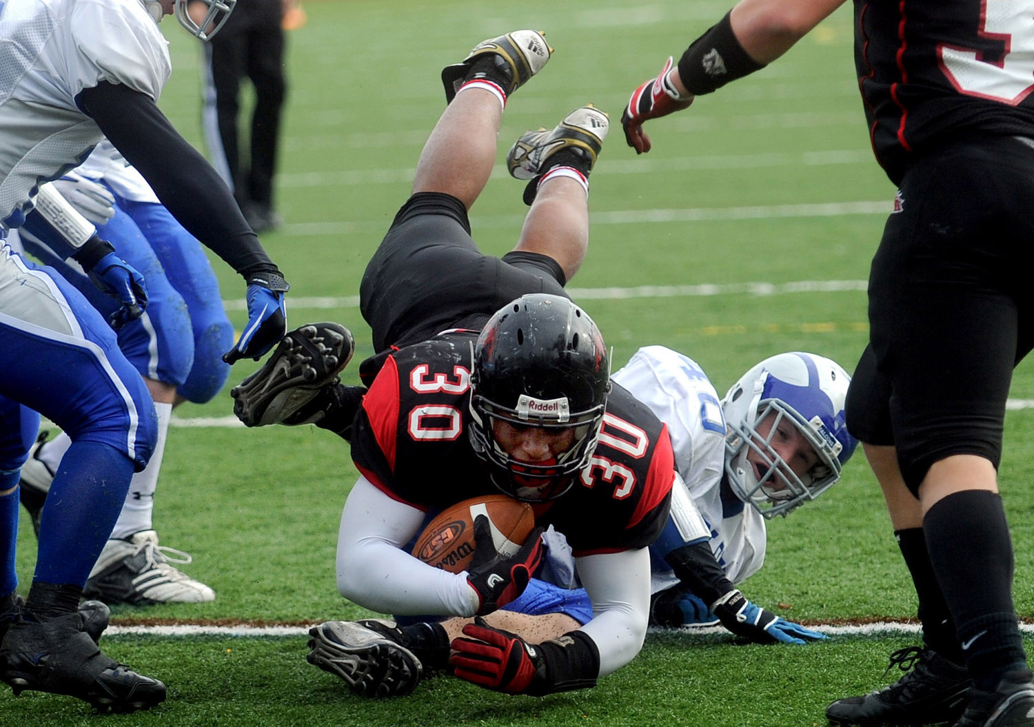  Warde's Alex Delaney dives into the end zone for a touchdown during the Thanksgiving Day game against Fairfield Ludlowe November 25, 2010. 