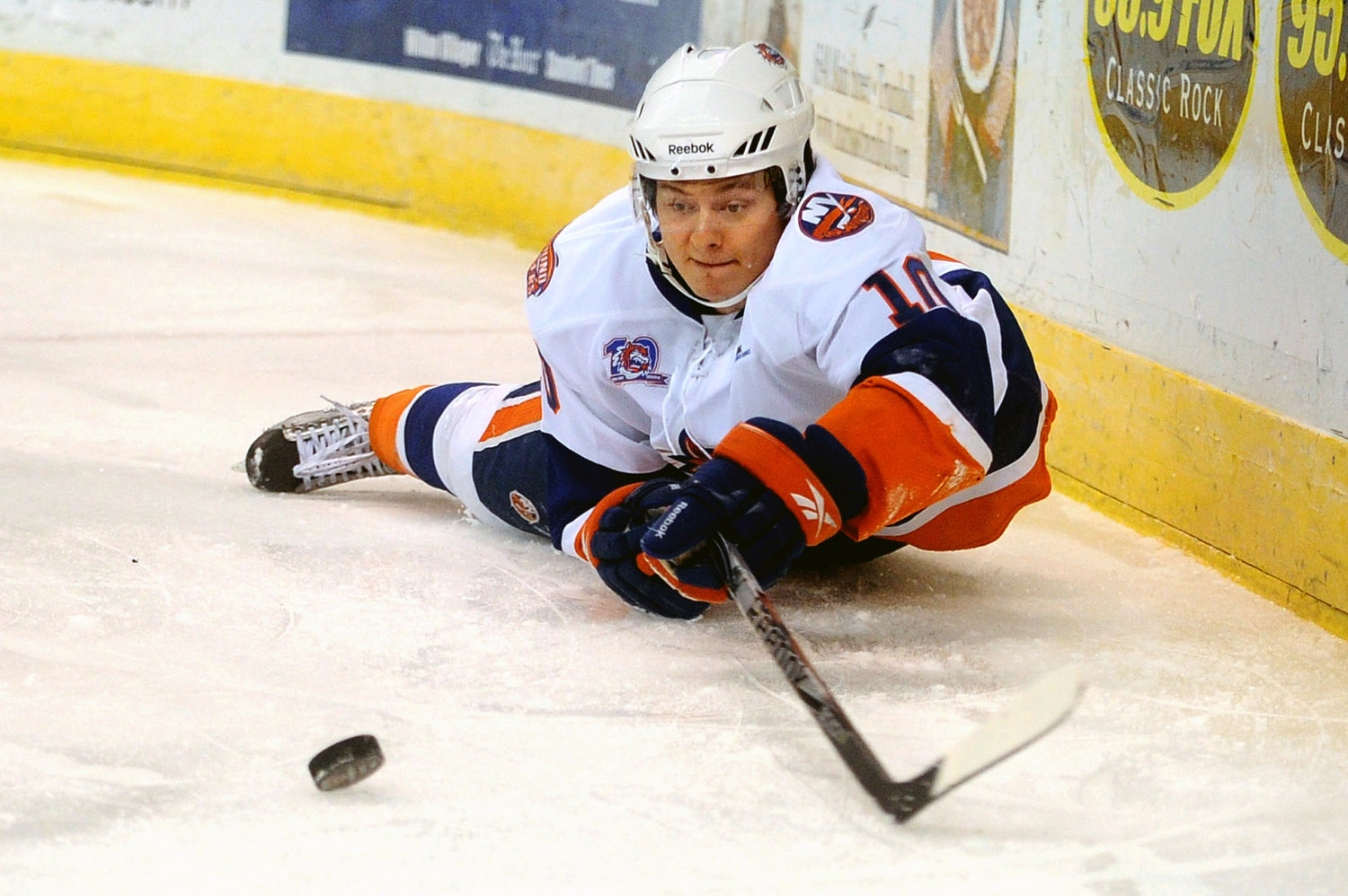  The Soundtigers' Rhett Rakhshani reaches for the puck after falling during Friday's game against the Hartford Wolf Pack at the Arena at Harbor Yard November 26, 2010. 