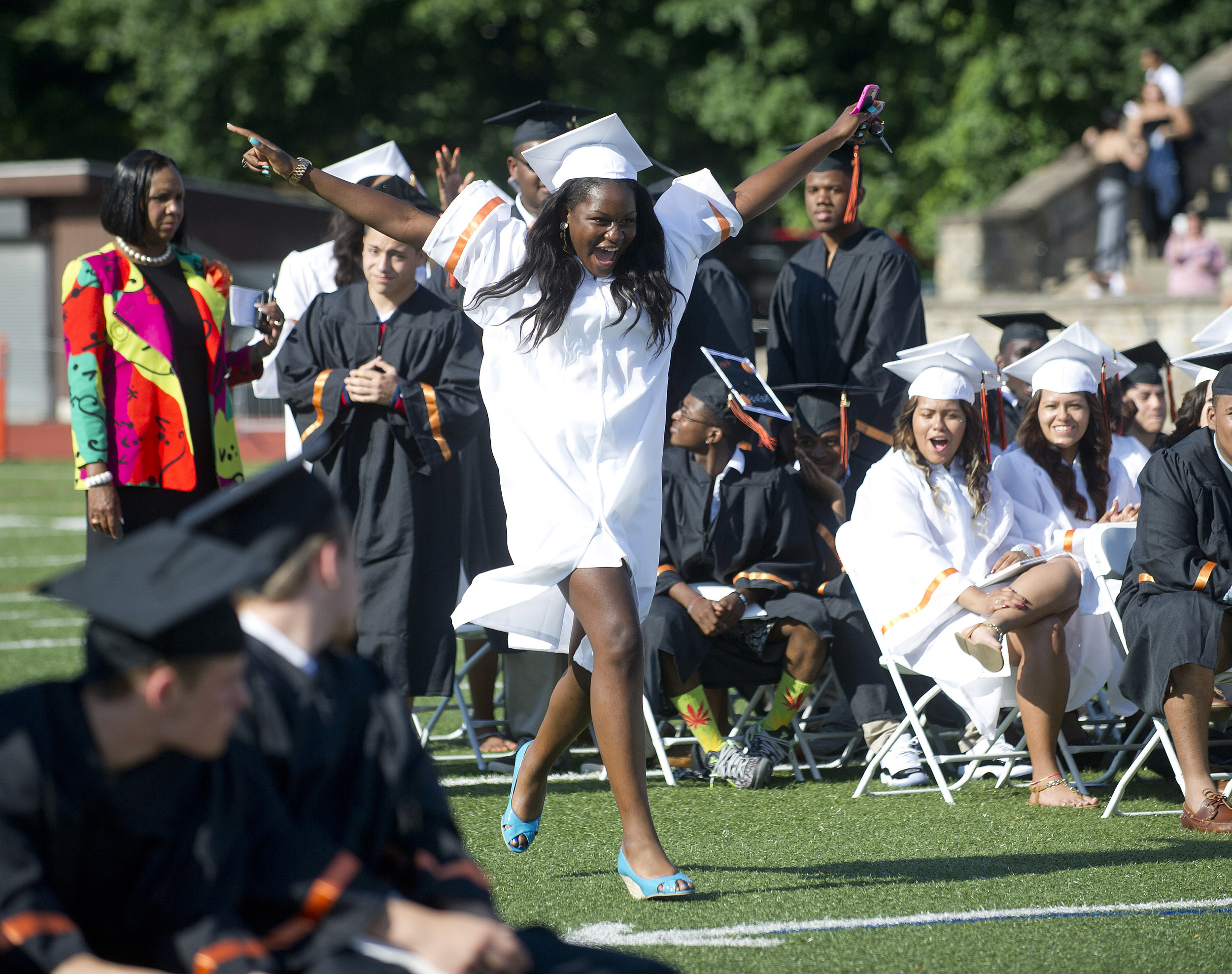  Stetya Jean Baptiste dances her way to the podium to get her diploma during the Stamford High School commencement ceremony on Thursday, June 19, 2014. 