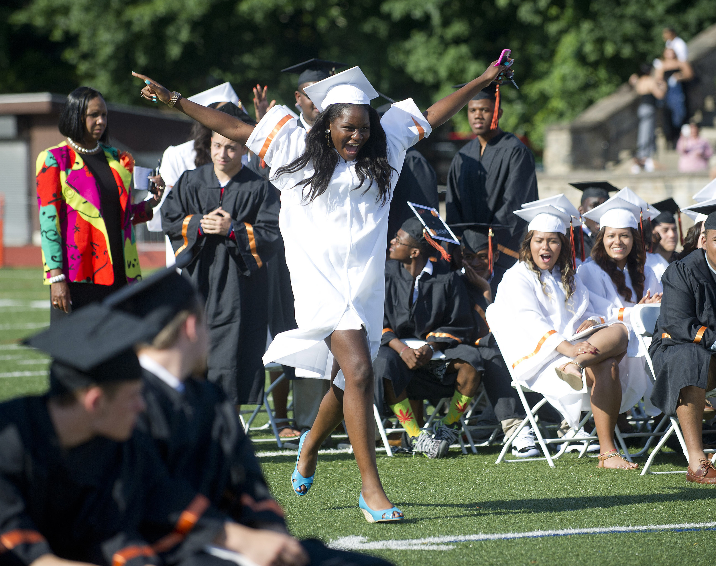 Stetya Jean Baptiste dances her way to the podium to get her diploma during the Stamford High School commencement ceremony on Thursday, June 19, 2014.