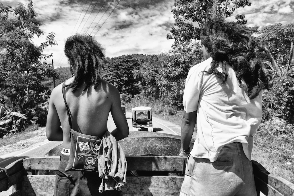 Alfredo and Jesús hitchhike to the nearest town, Pichanaki 