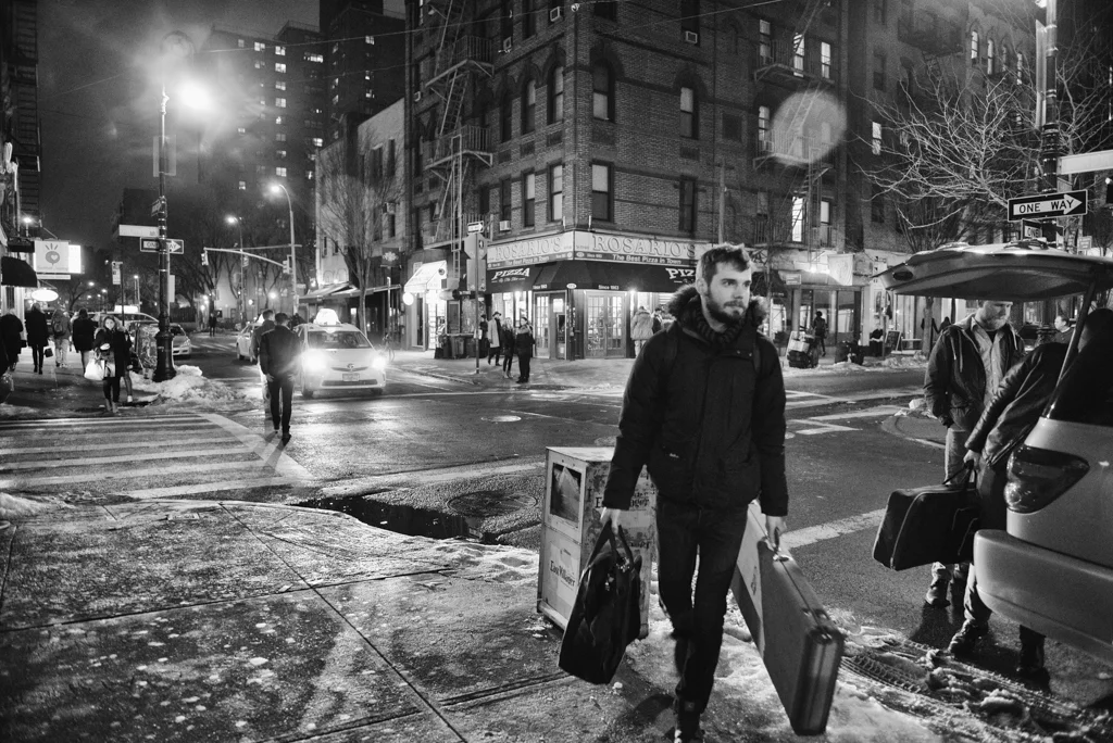 Tom Barnes of Slush & Lean carries instruments and gear to a show on the Lower East Side of Manhattan 