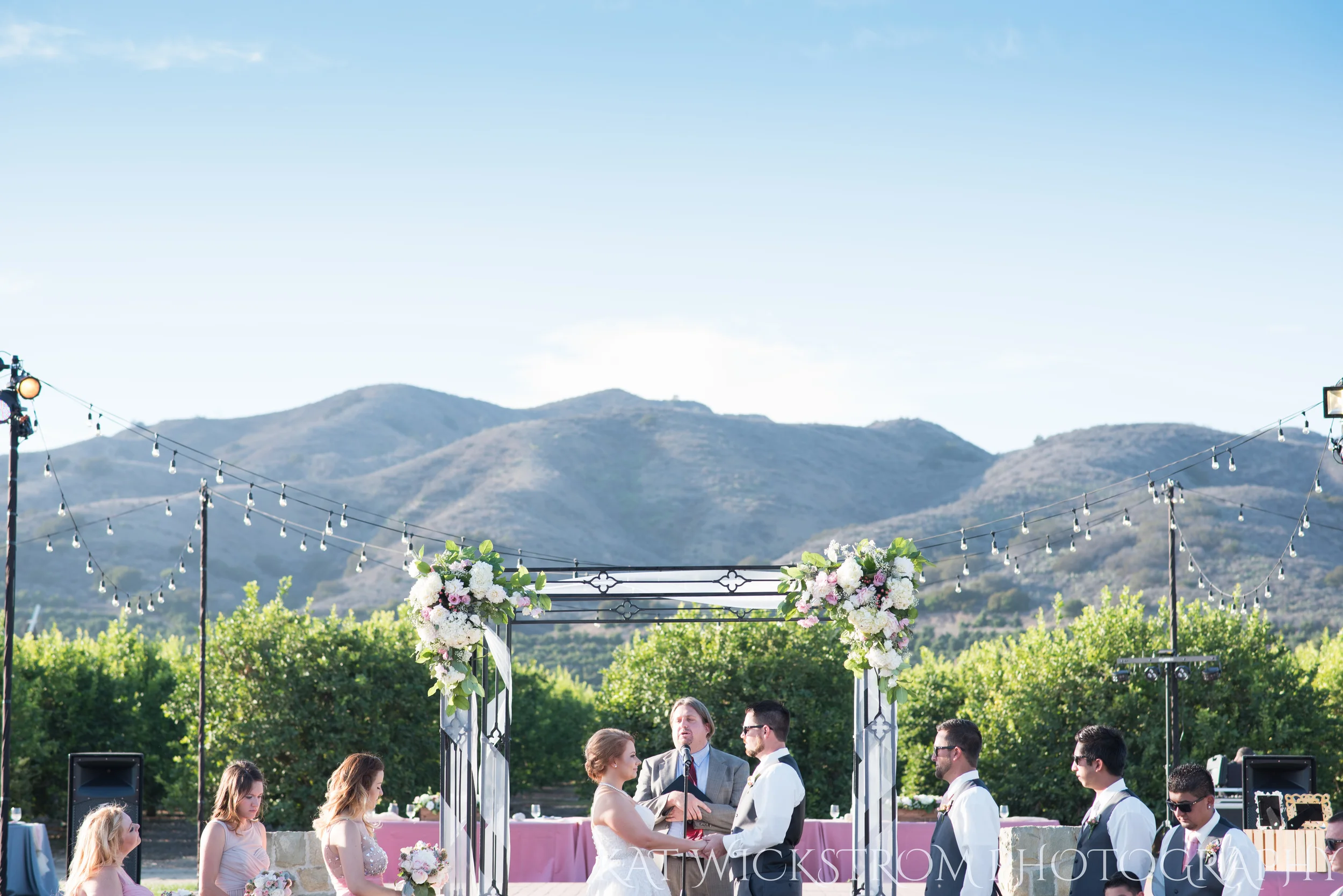 The setting for the ceremony was at the end of the court, right before a small field. The field had all of the reception area. But look at those mountains!