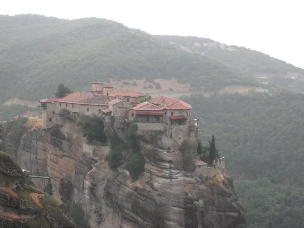 Meteora is a collection of monasteries perched high up on these pillar cliffs. It's a majestic view for sure.