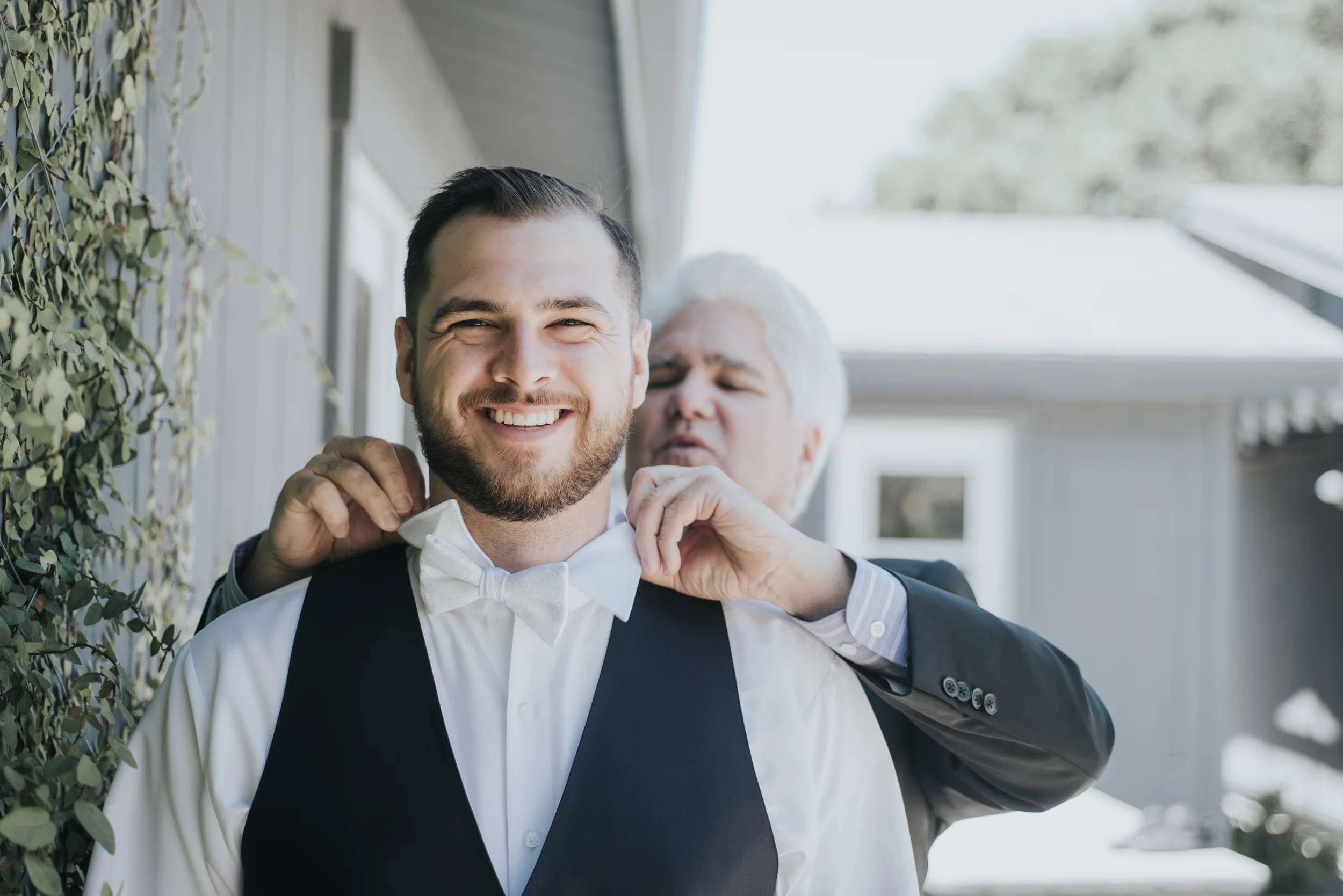 Dad helped put on the bow tie.