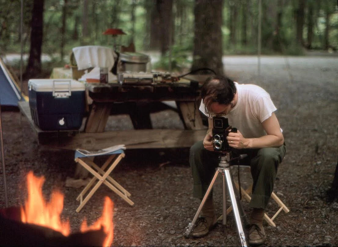 A vintage image of a man using a twin lens camera for Kat Wickstrom Photography, an adventure destination wedding and elopement photographer