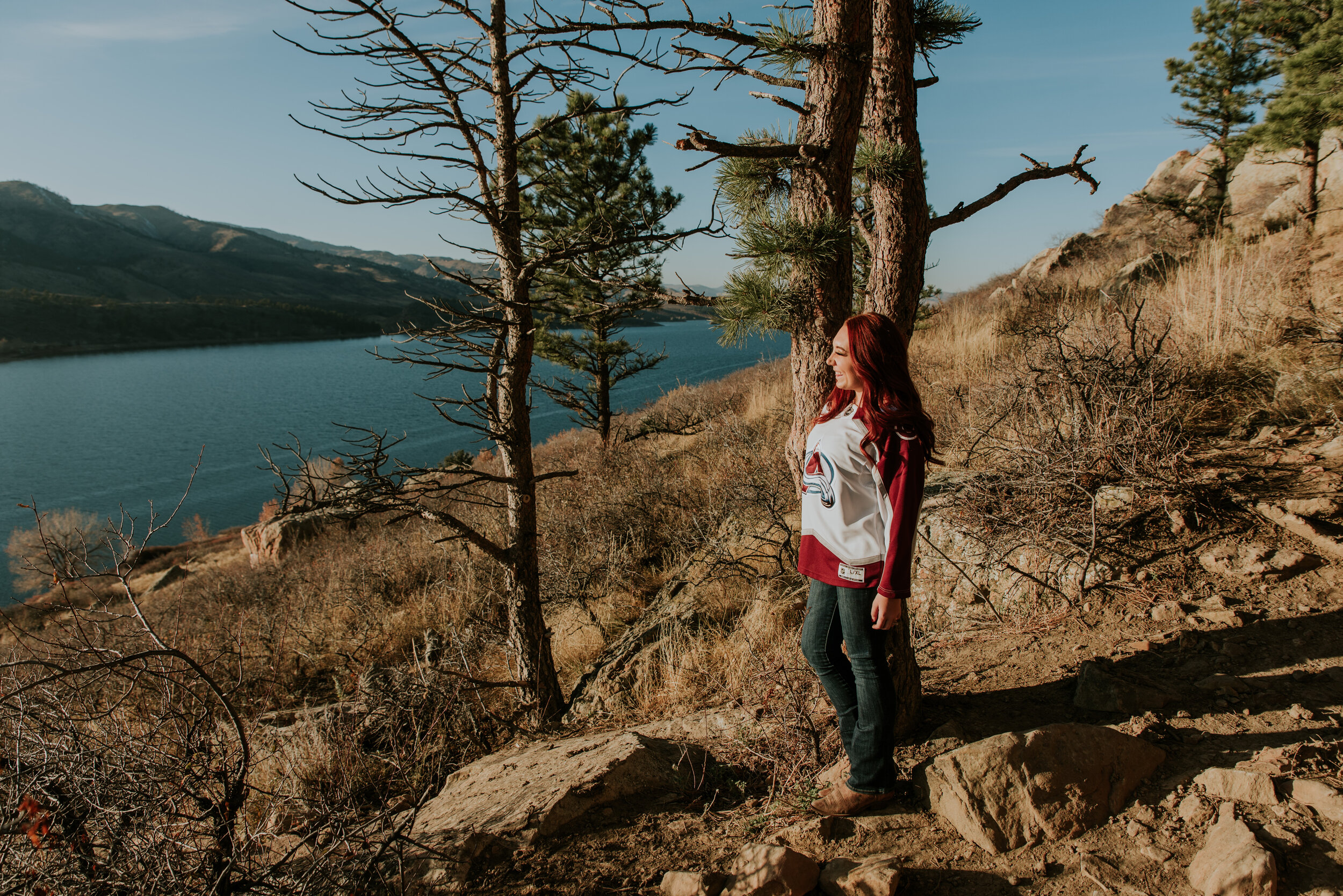 bride-looks-at-lake-during-engagement-photo-shoot
