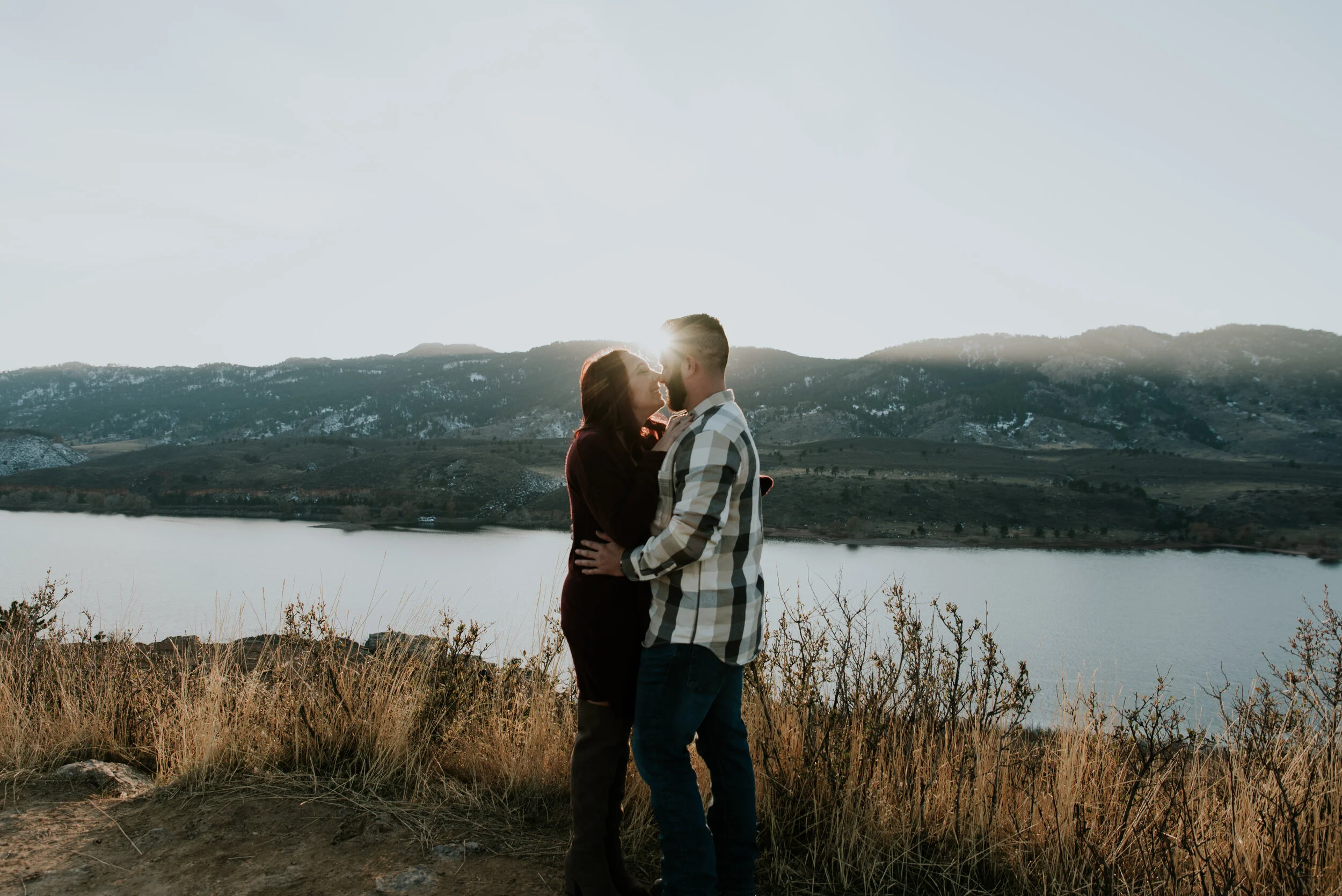 couple-embraces-over-horsetooth-reservoir