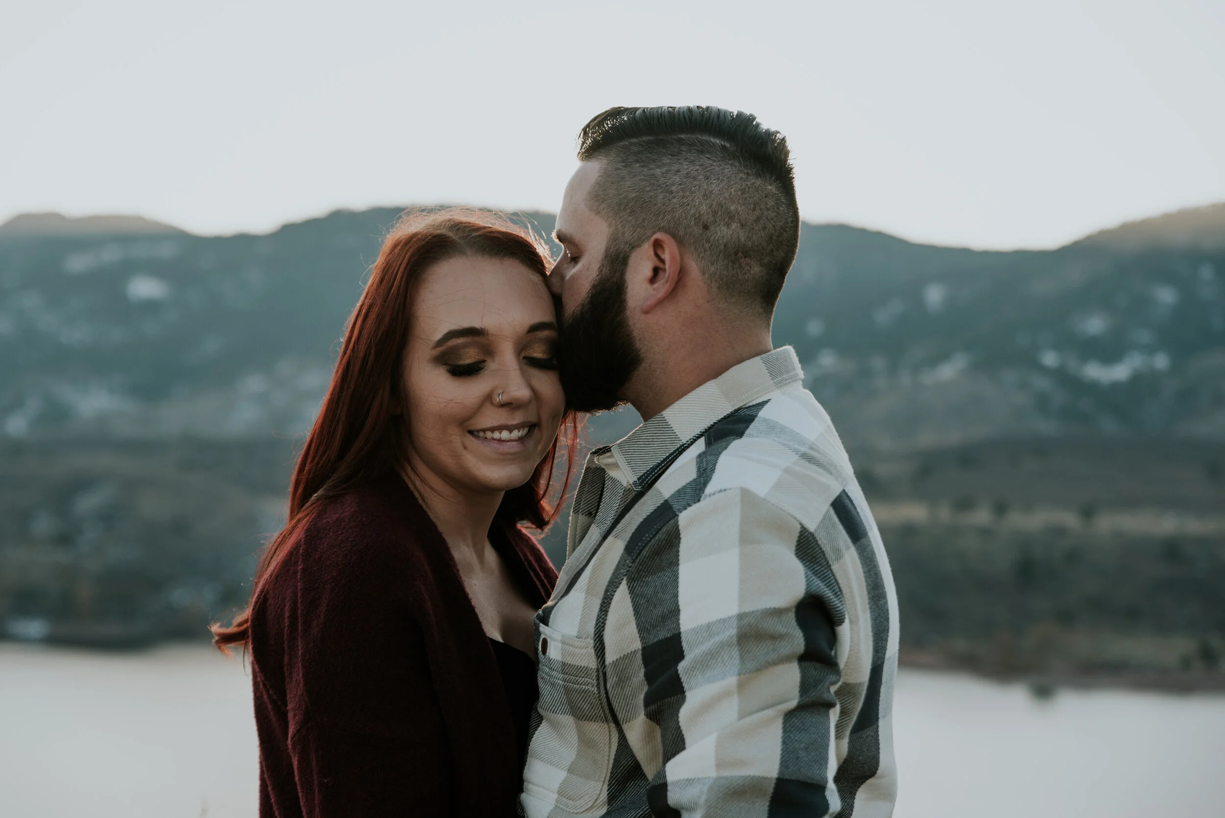 couple-embraces-at-horsetooth-reservoir-engagement-photo-session