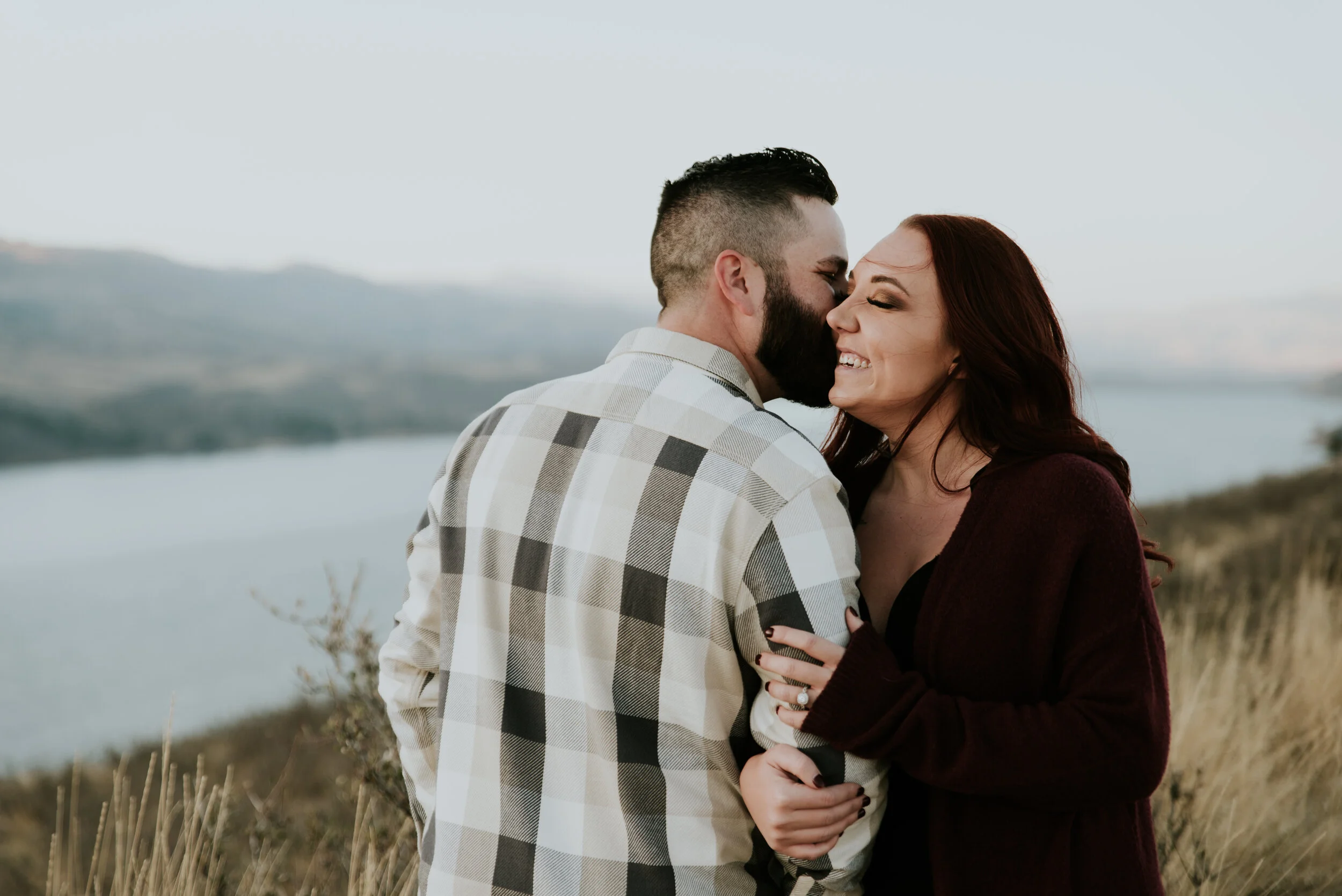 couple-kissing-in-horsetooth-reservoir-engagement-photo