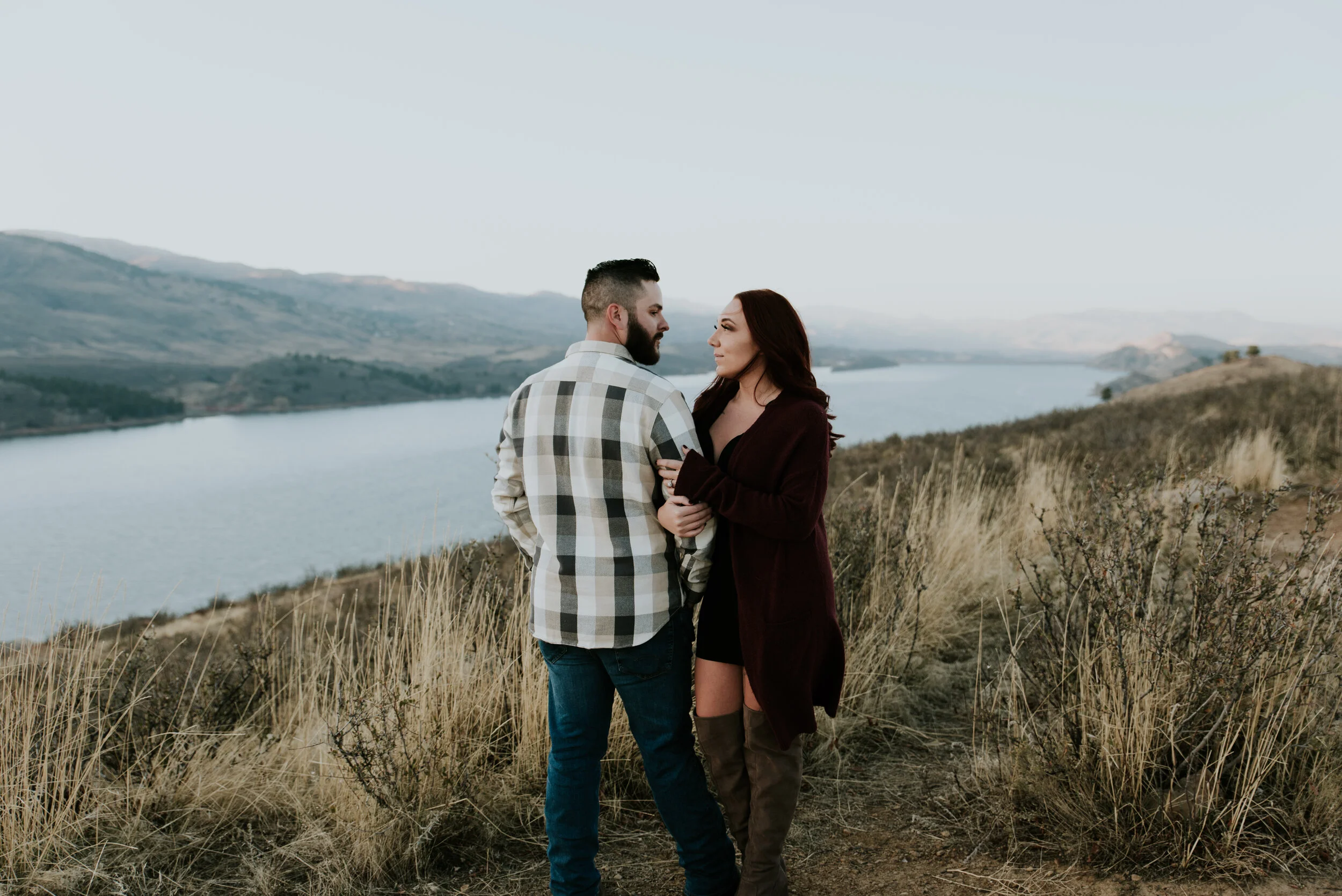 couple-holding-each-other-at-Horsetooth-Reservoir-engagement-session