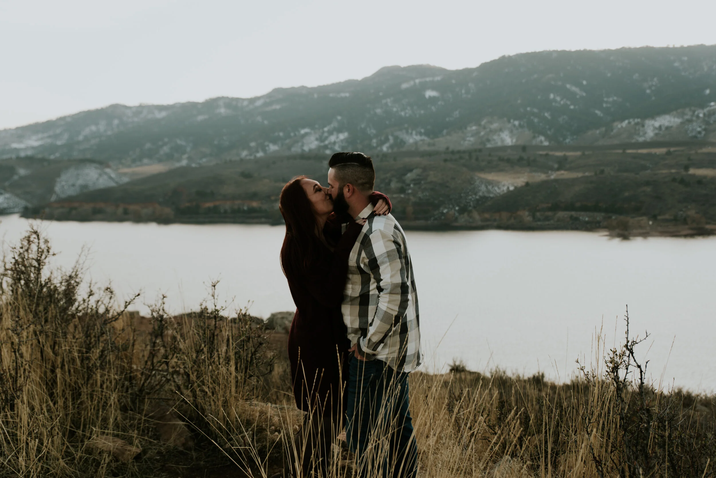 couple-kissing-at-horsetooth-reservoir-engagement-photo-session