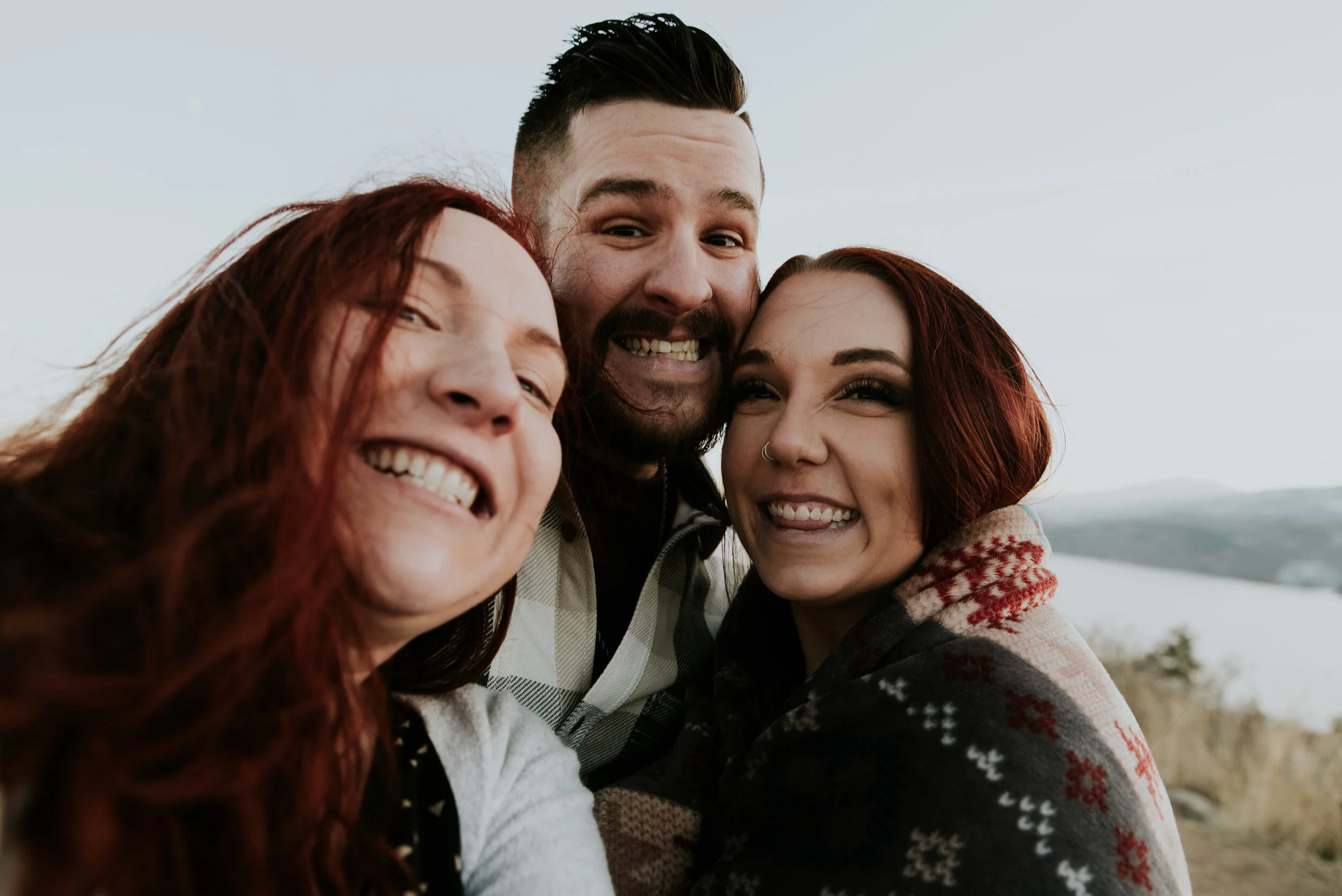 couple-poses-with-photographer-at-horsetooth-reservoir