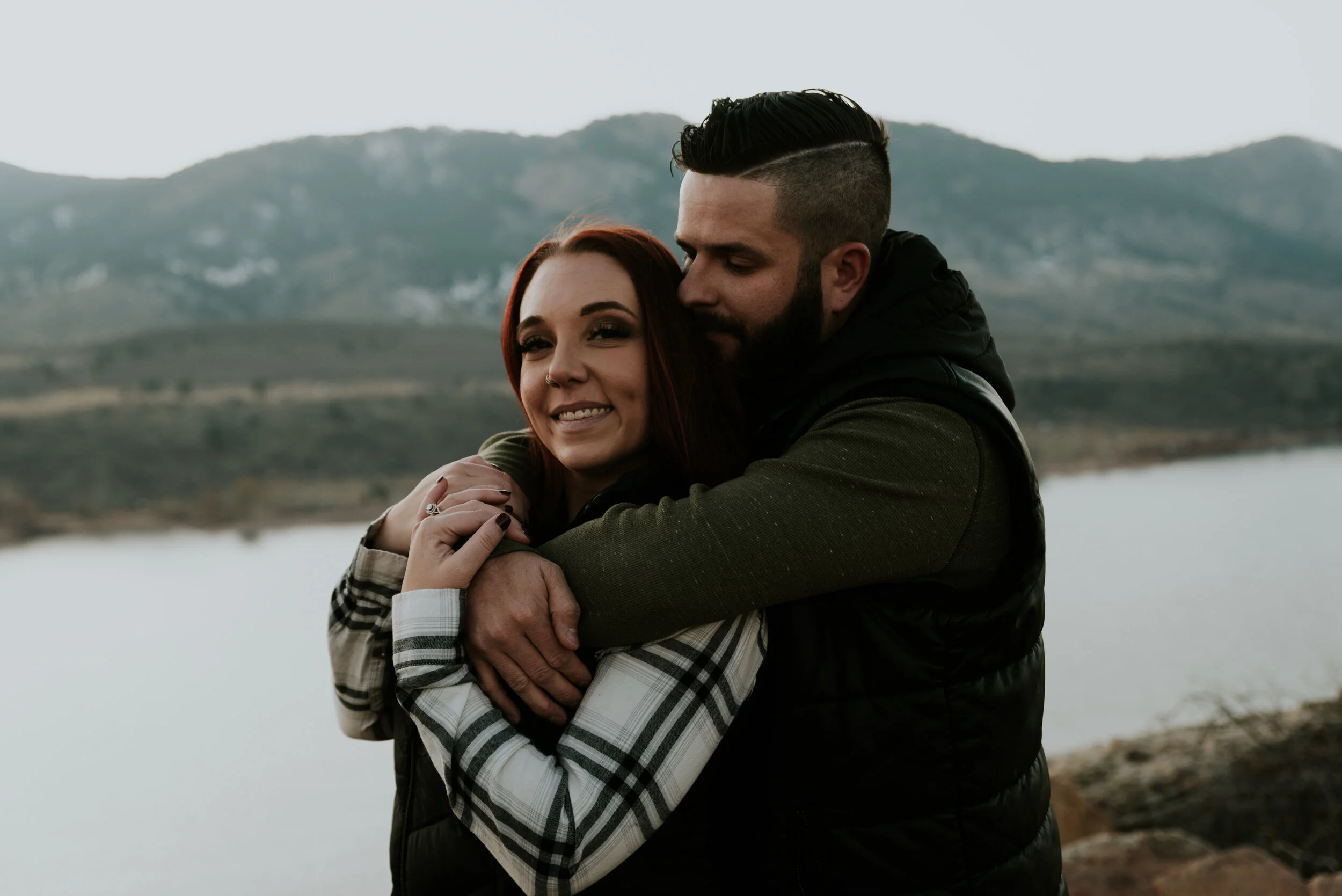 couple-embraces-in-Colorado-mountains