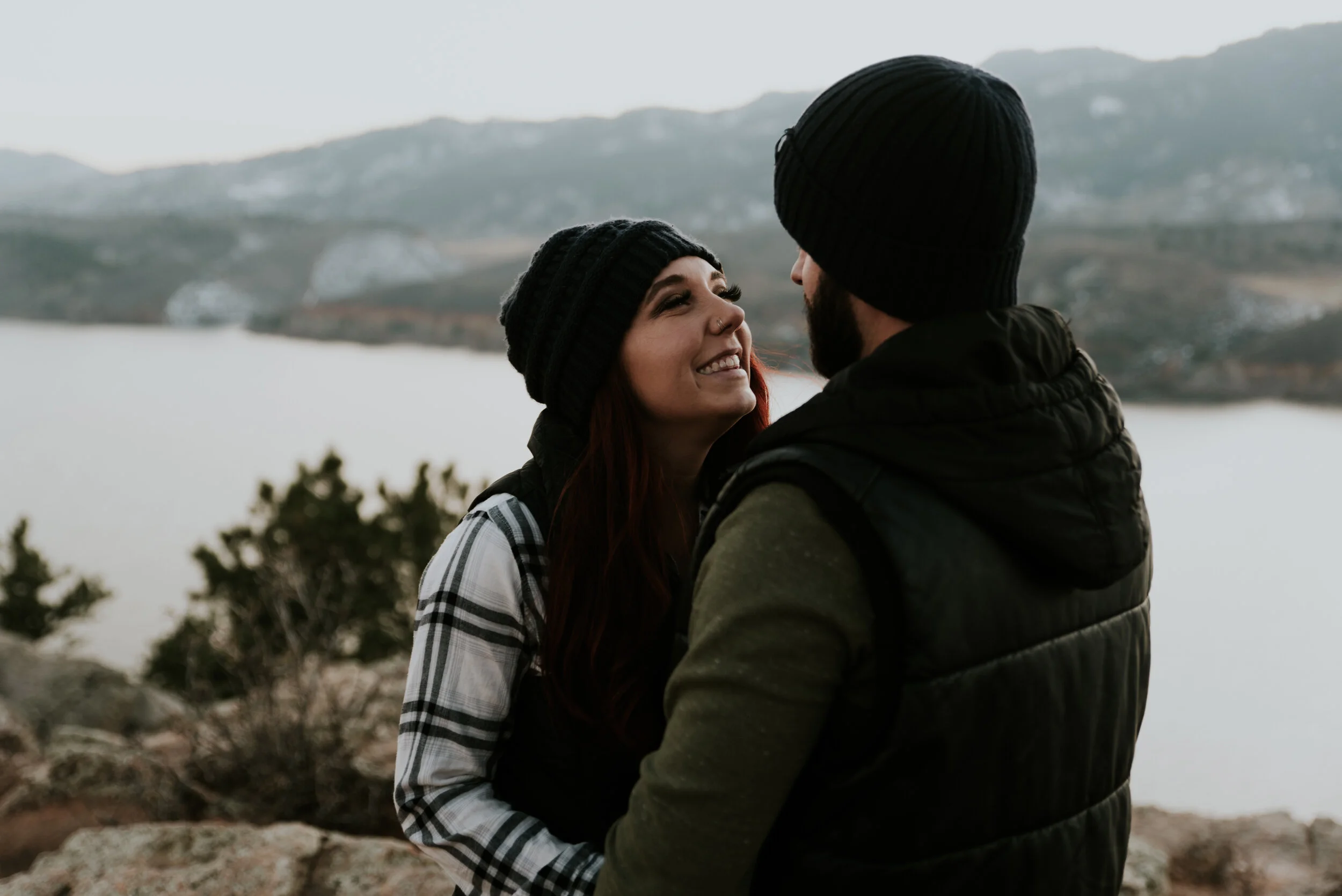 couple-gazes-at-each-other-during-horsetooth-reservoir-engagement-shoot