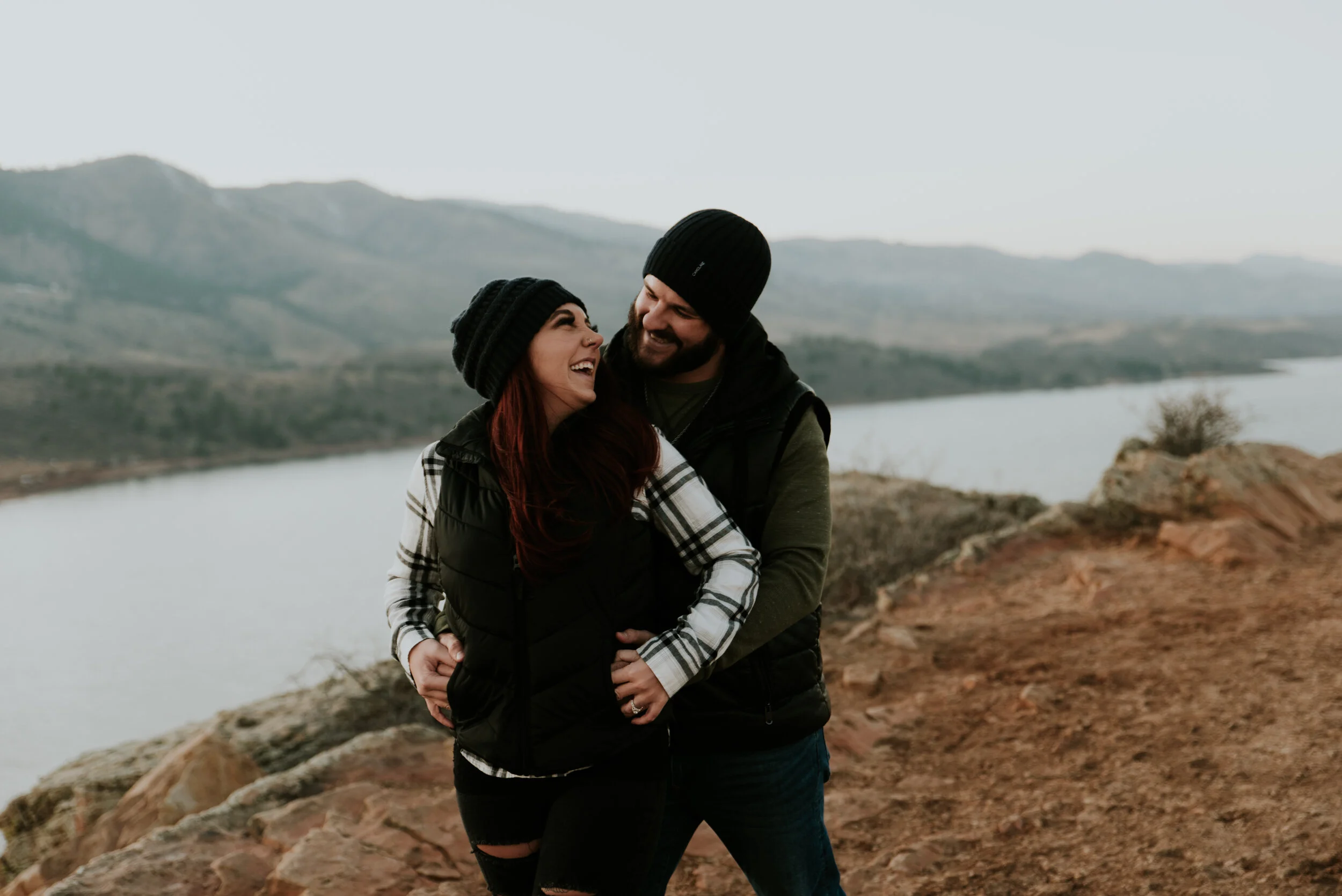 couple-hugging-on-mountain-near-horsetooth-reservoir