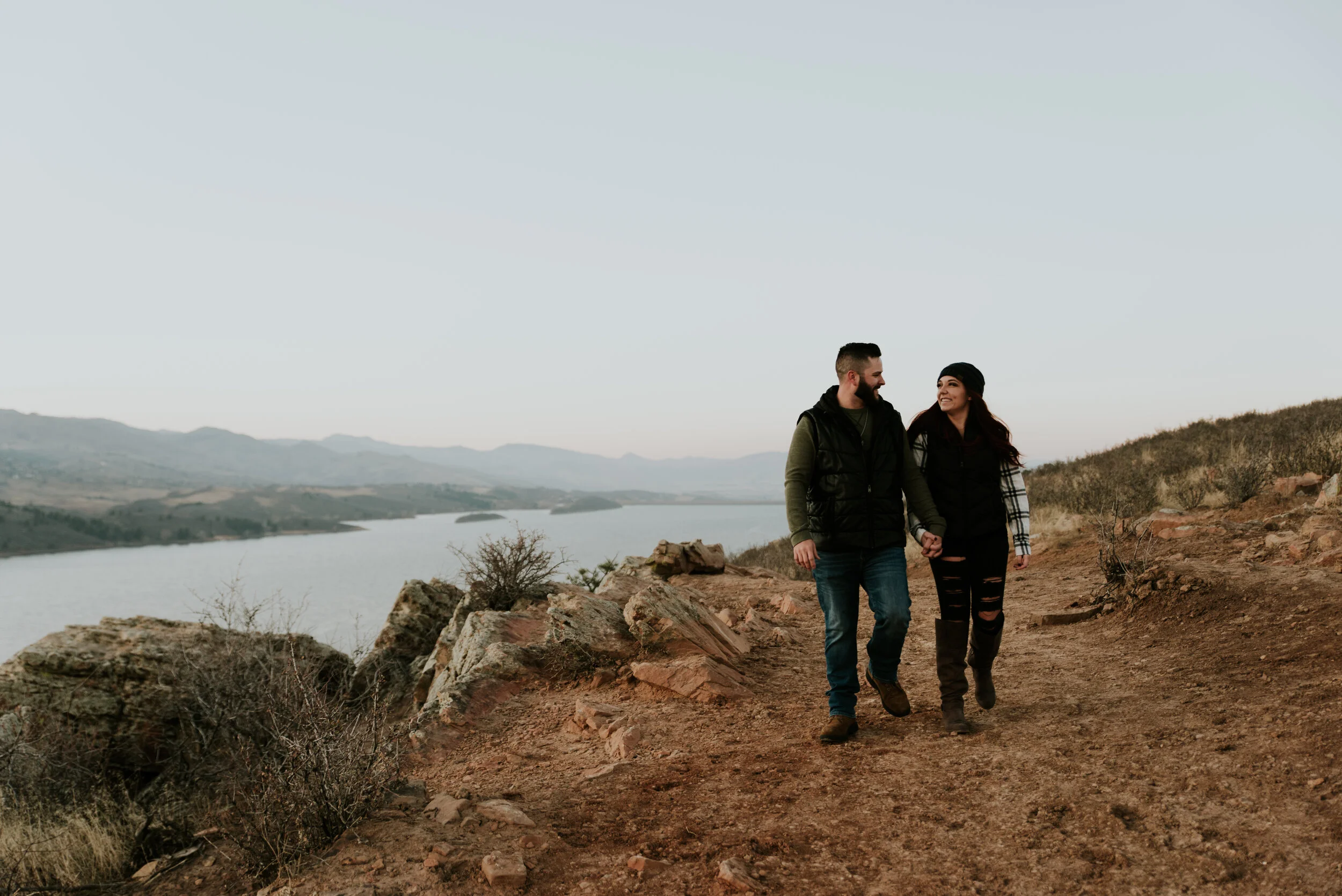 couple-walks-on-trail-during-front-range-engagement-shoot