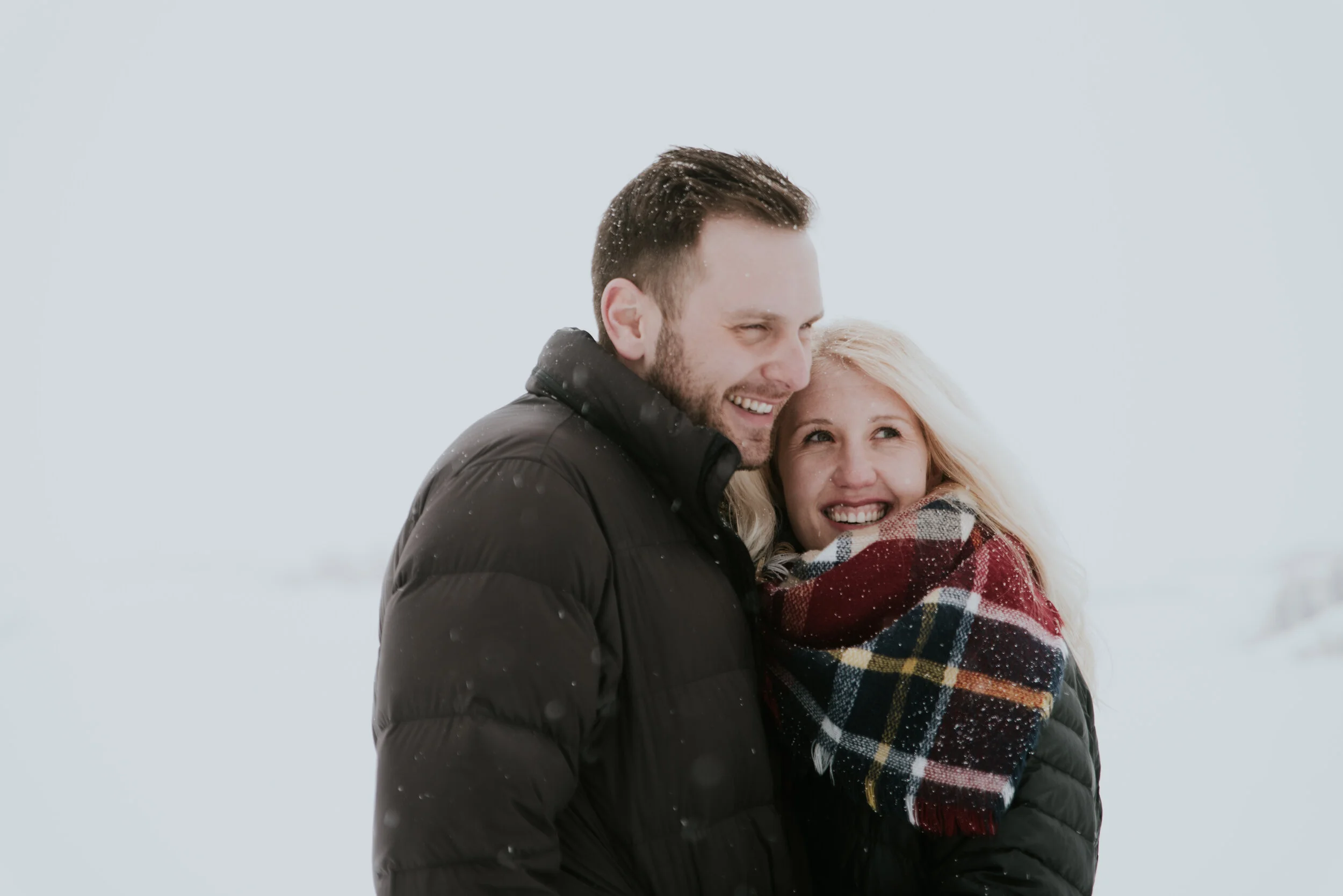 couple-laughs-in-engagement-photo