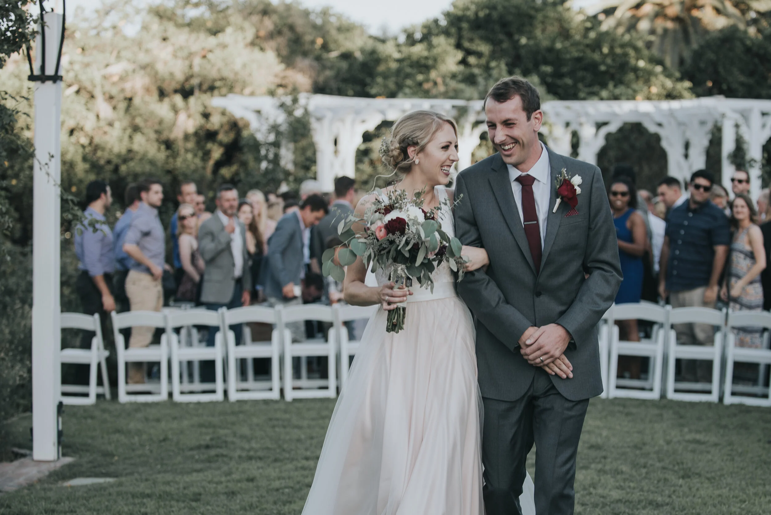 A couple exits the ceremony during a typical wedding timeline