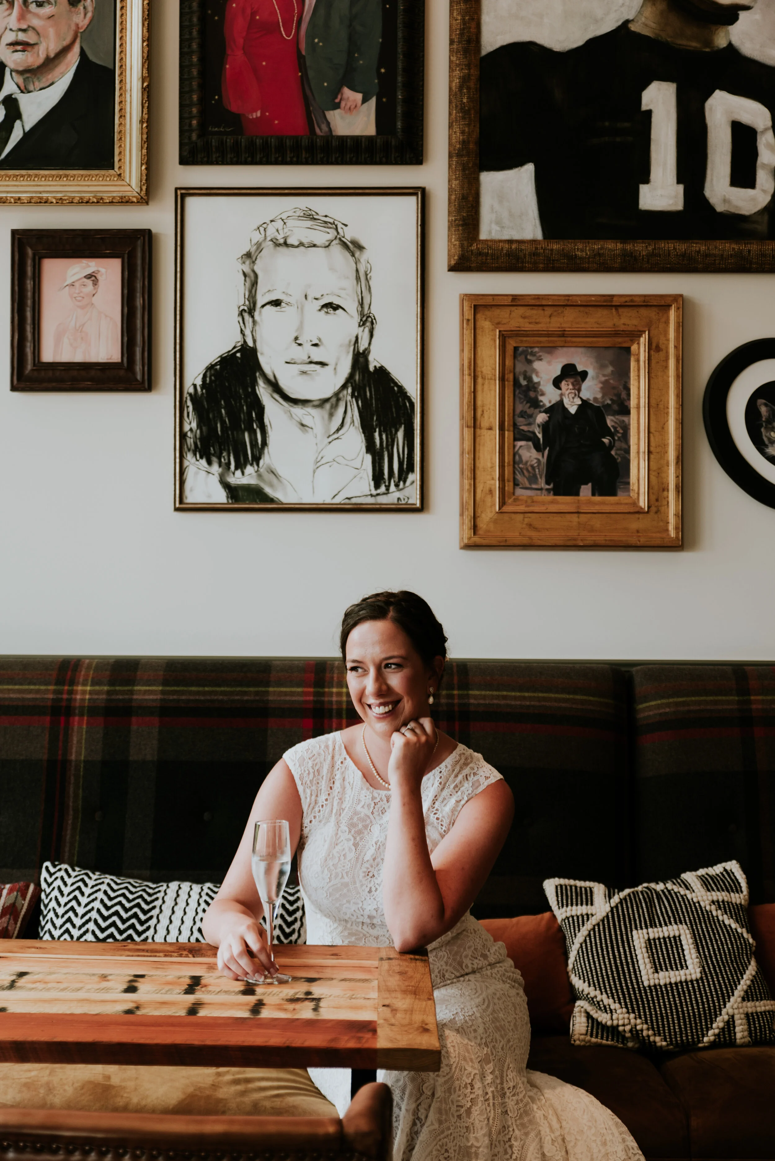 A Bride sits with champagne contemplating how to plan a destination wedding or elopement