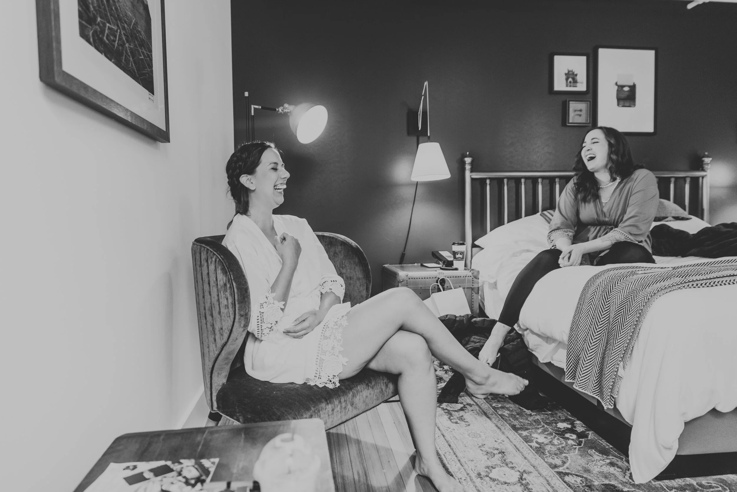 Bride laughs with friends at an elopement that includes family