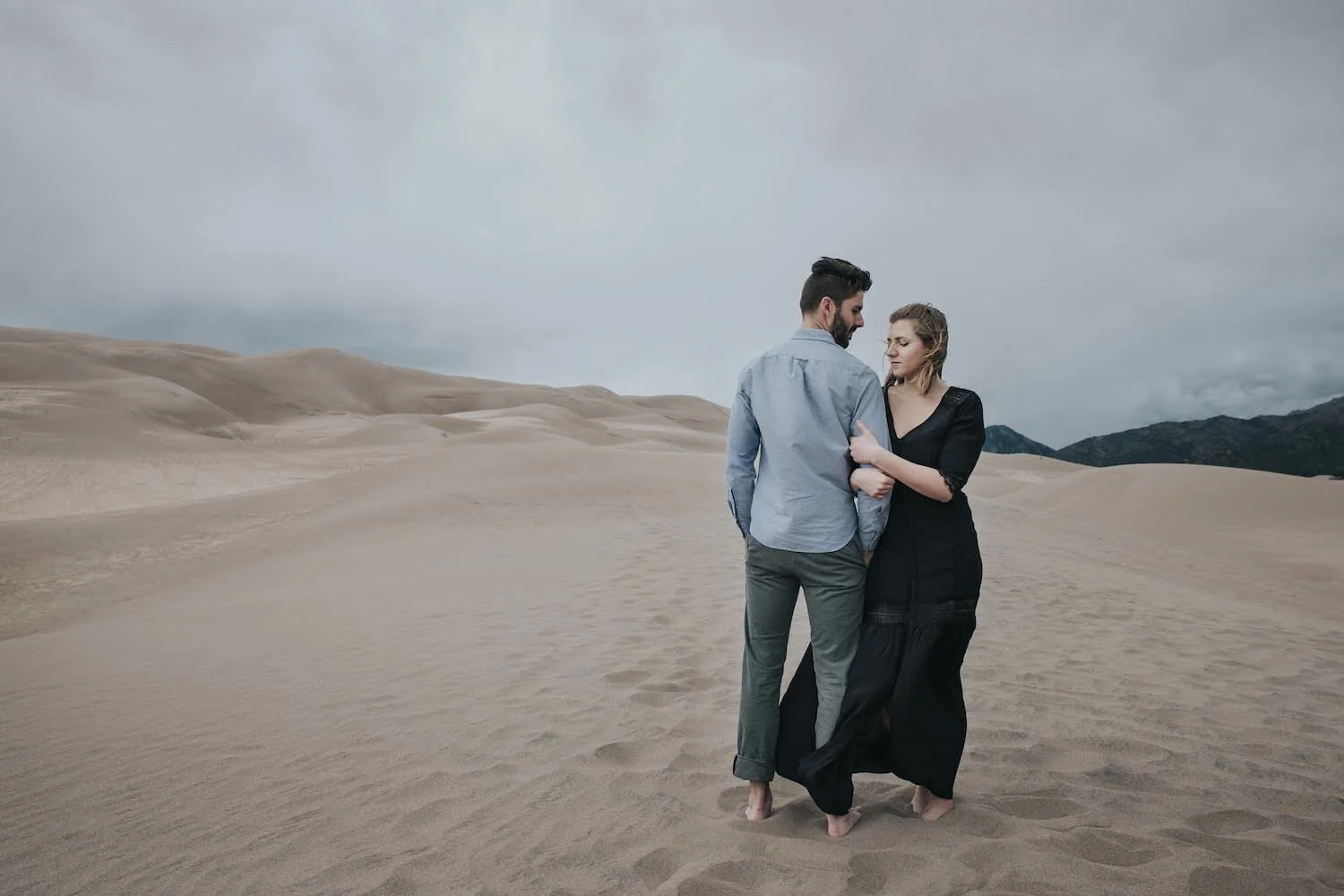 A couple eloping on sand dunes in Colorado