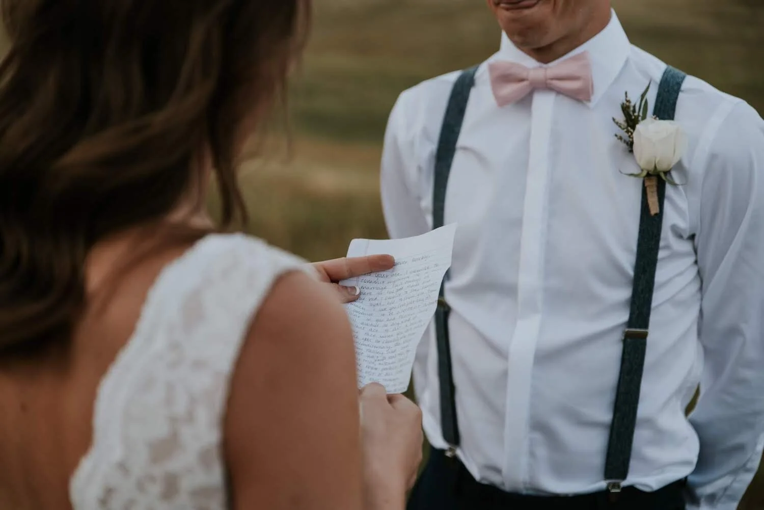 Couple exchanging vows in an intimate elopement on a mountain in Colorado