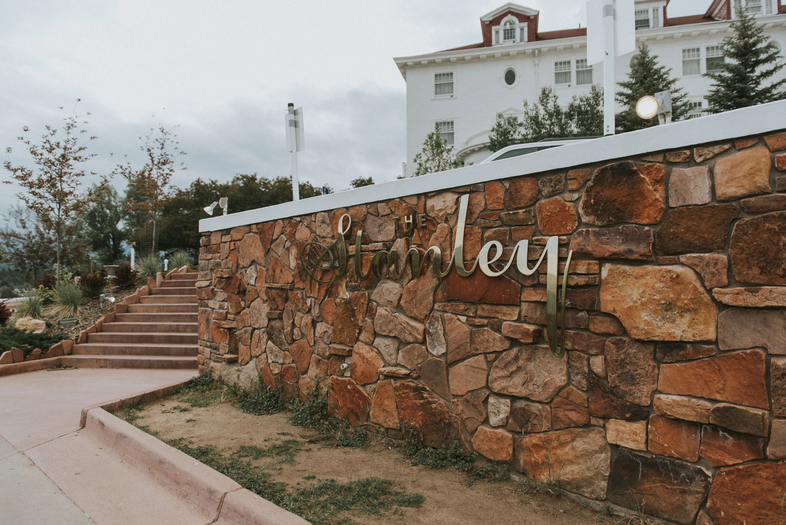 sign_of_the_stanley_hotel_in_estes_park_during_engagement_session