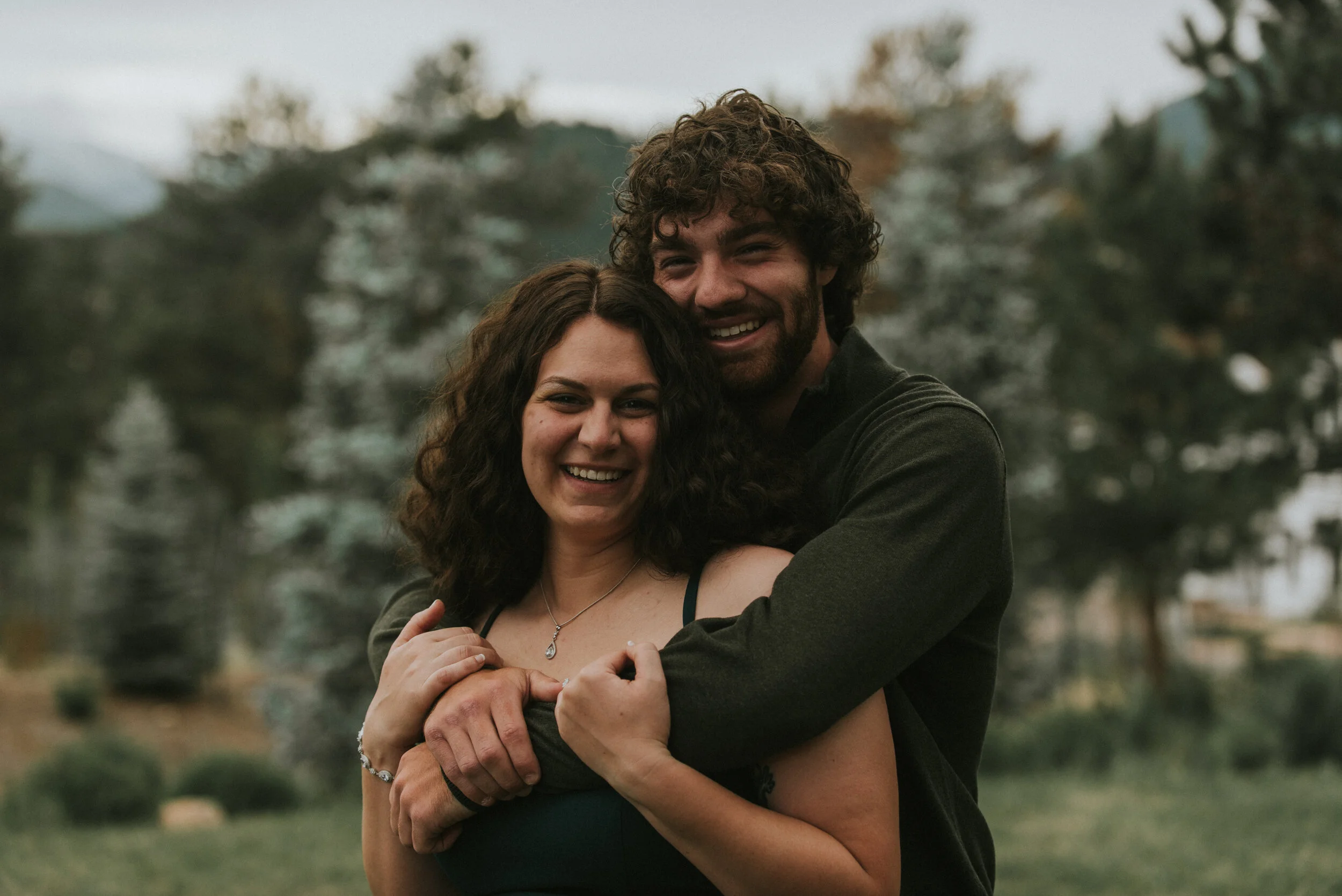 couple_embraces_in_mountain_engagement