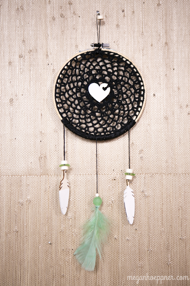 I made this dream catcher by inserting a doily into an embroider hoop. I then stitched the wood veneer heart to the center and strung the feathers. All supplies from Michaels (except the beads, which I had on hand).