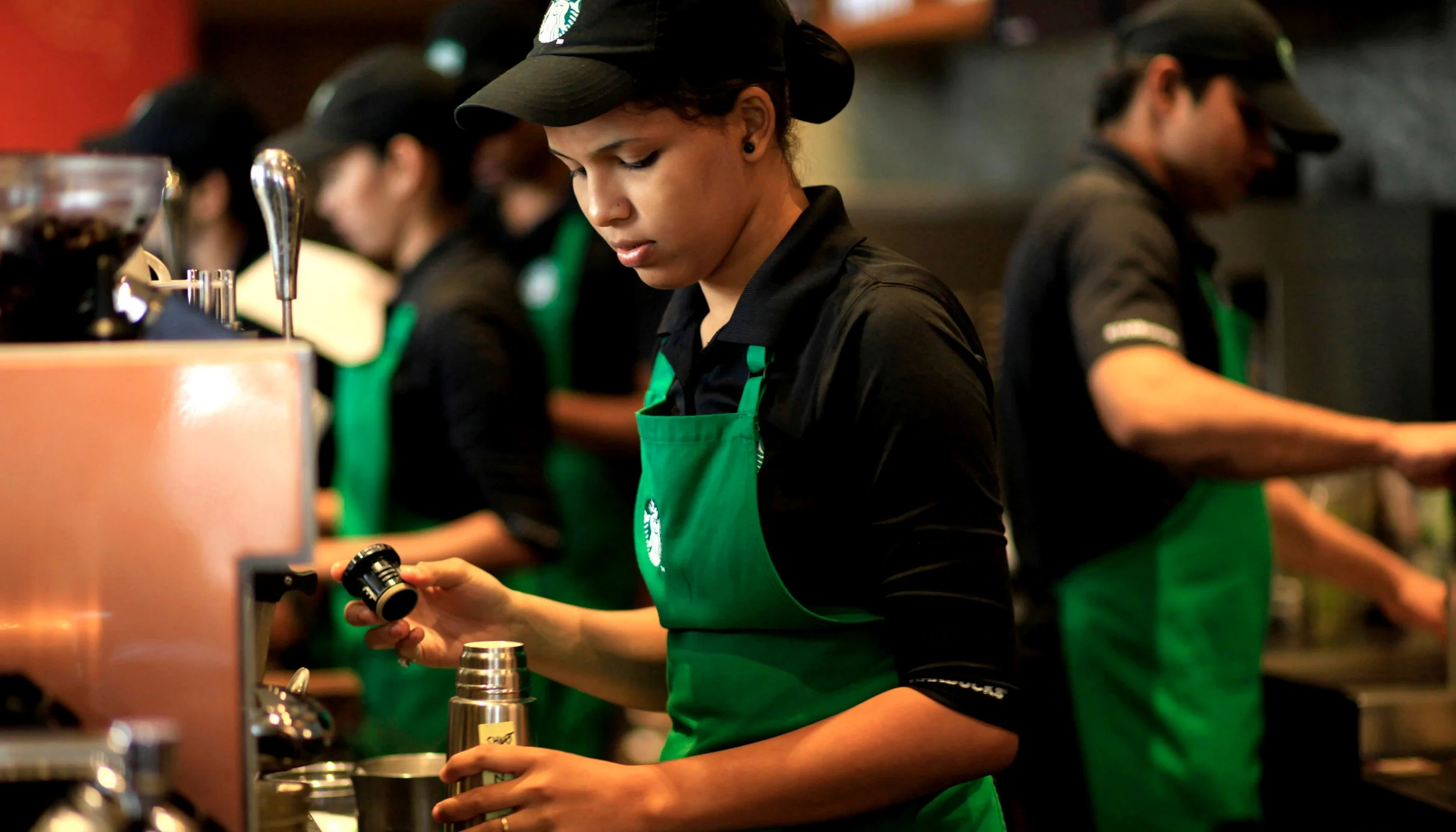 Employees_work_inside_the_Starbucks_at_the_Taj_Mahal_Palace_hotel_in_south_Mumbai%2C_India.jpg