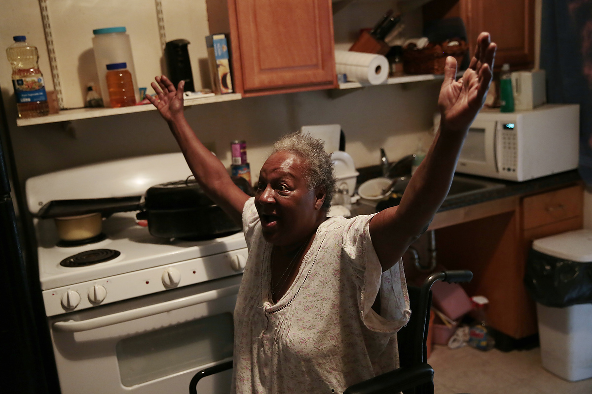 Rhonda Marshall, 59, tells her friend about her problems trying to have management fix a broken lock on her front door in her apartment in the Hacienda housing complex in Richmond, California, Friday, February 6, 2015. She has had moving boxes packed with her belongings for more than a year as she anticipated a voucher allowing her to relocate from the Hacienda housing complex. Today it was announced that current residents of the Richmond Housing Authority owned and maintained complex would receive Section 8 vouchers to find housing as the housing complex is renovated and long-standing problems with the building are addressed. 