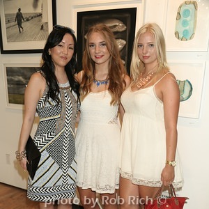 Ellen Himic and attendees view the art to be auctioned.