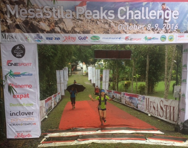 Jessica Lintanga arrives to win the women's 4 Peaks race in another downpour