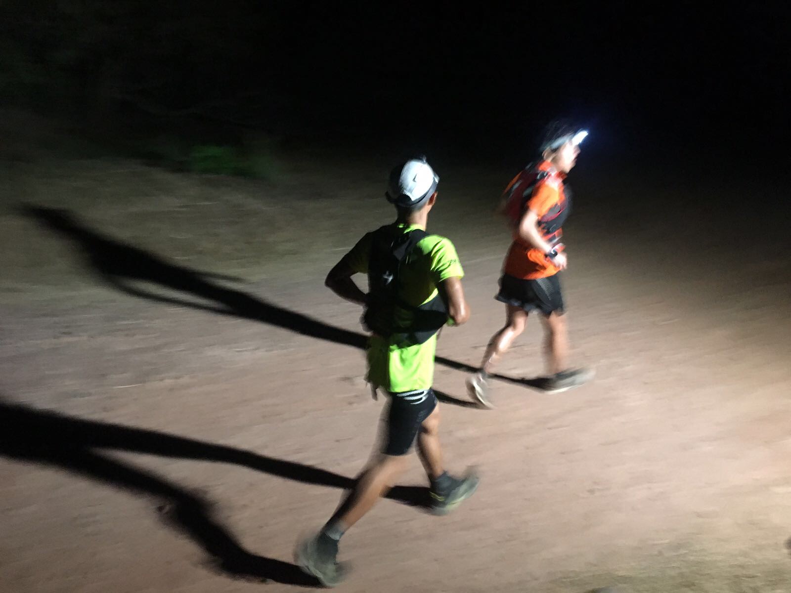 Steven Oong catches a dehydrated Wataru Iino just before the final checkpoint