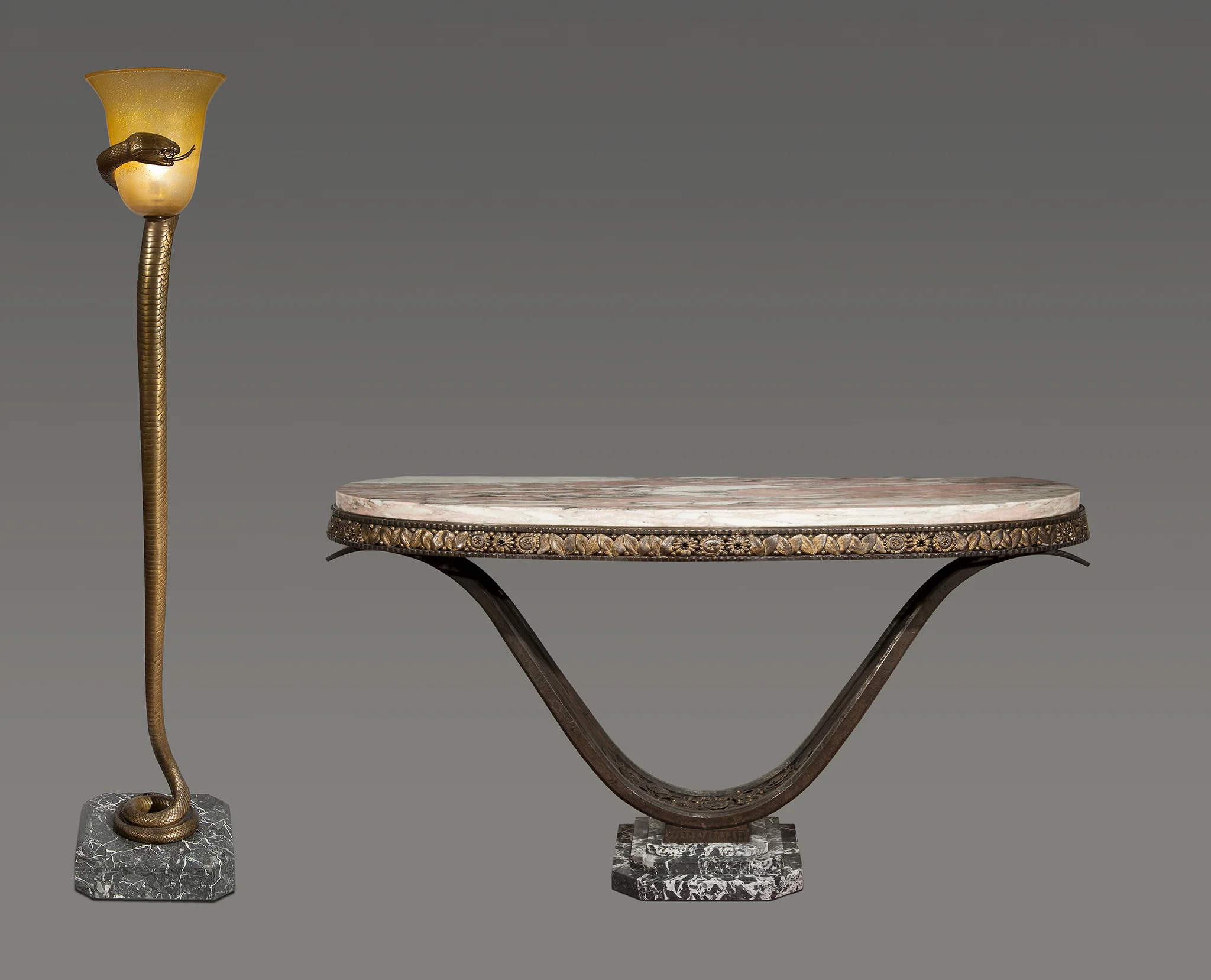 Antique console in patinated wrought iron, steel and marbre and 'La Tentation' bronze and glass floor lamp by Edgar Brandt 1925 Courtesy of Robert Zehil Gallery