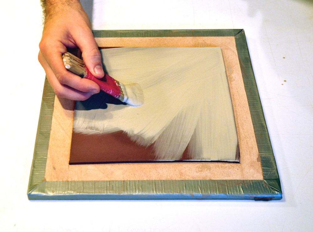PHOTO A: Applying slip to leather hard clay 