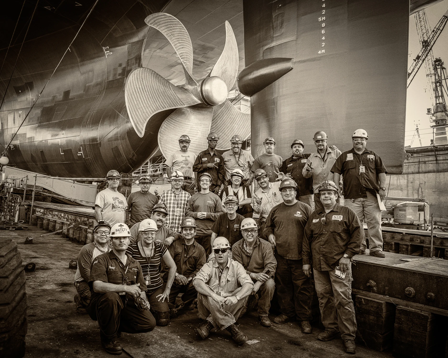 Sometimes the group shot happens organically. It all comes together with little or no production. It's more of a feel, an emotion. Pride and satisfaction can be a great motivator. Everyone proud of their part and happy to share that with peers. This is part of the crew that built the Isla Bella - shot several hours prior to launch. There's a formality and familiarity to these groupings - one that seems passed down from generations of shipbuilders. This is one of 3 frames, no compositing, no production.