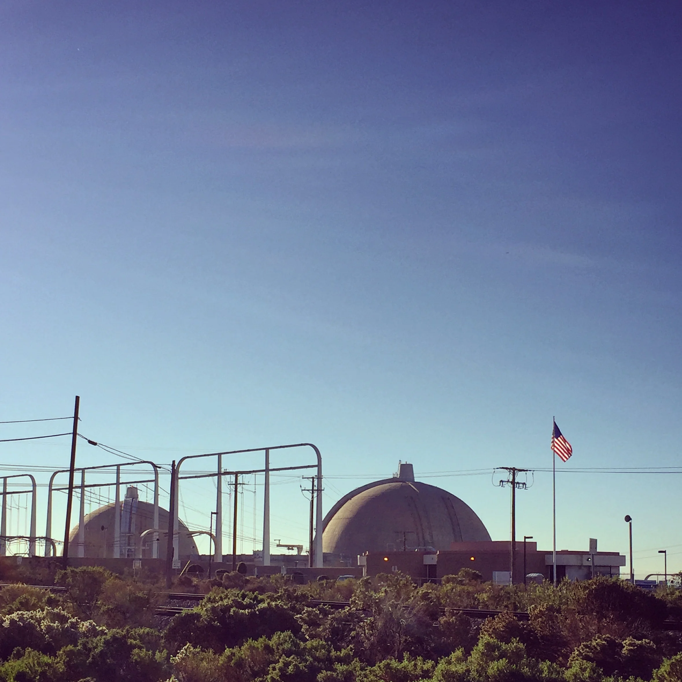 Sitting along the coast at the Northern most point of San Diego County just before the sprawl of The OC is the recently decommissioned San Onofre Nuclear Power Plant. Current negotiations center on who should pay for the shut down and where the spent fuel rods should be stored. It's an icon on the I-5 drive between San Diego and LA. 