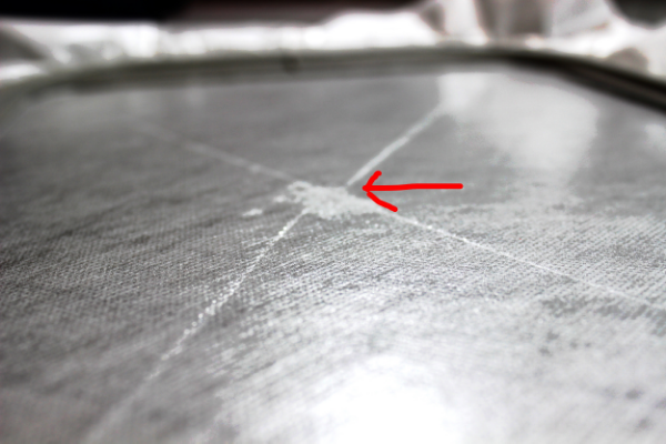 Finger prints and score marks on the tacky stabilizer.