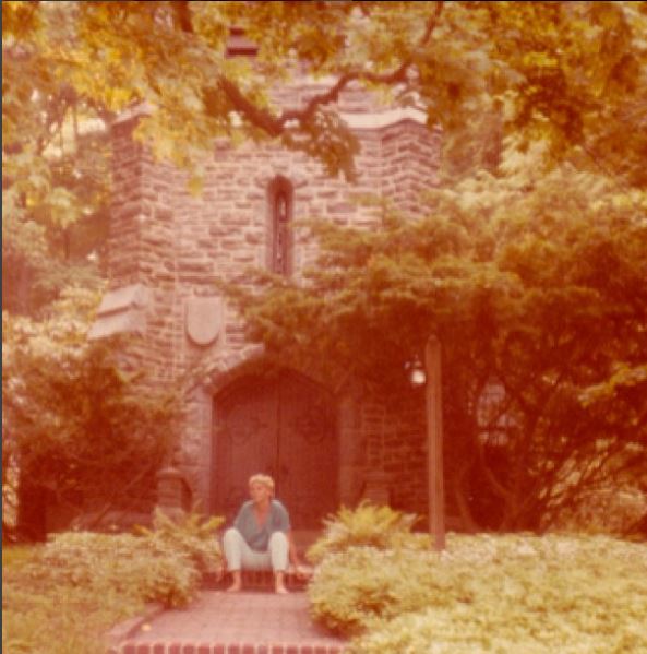 Marilyn Monroe seated in front of Mead Chapel