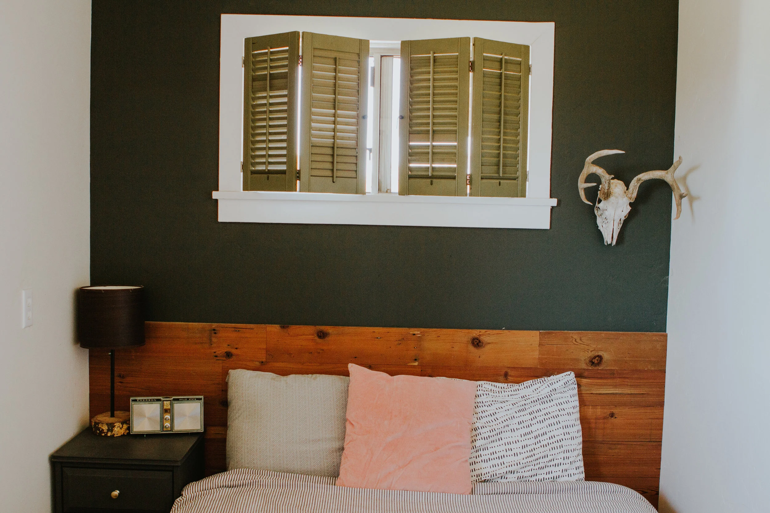 Since our room can only fit our bed we decided to add some wood to the wall to give our room a little more dimension. 