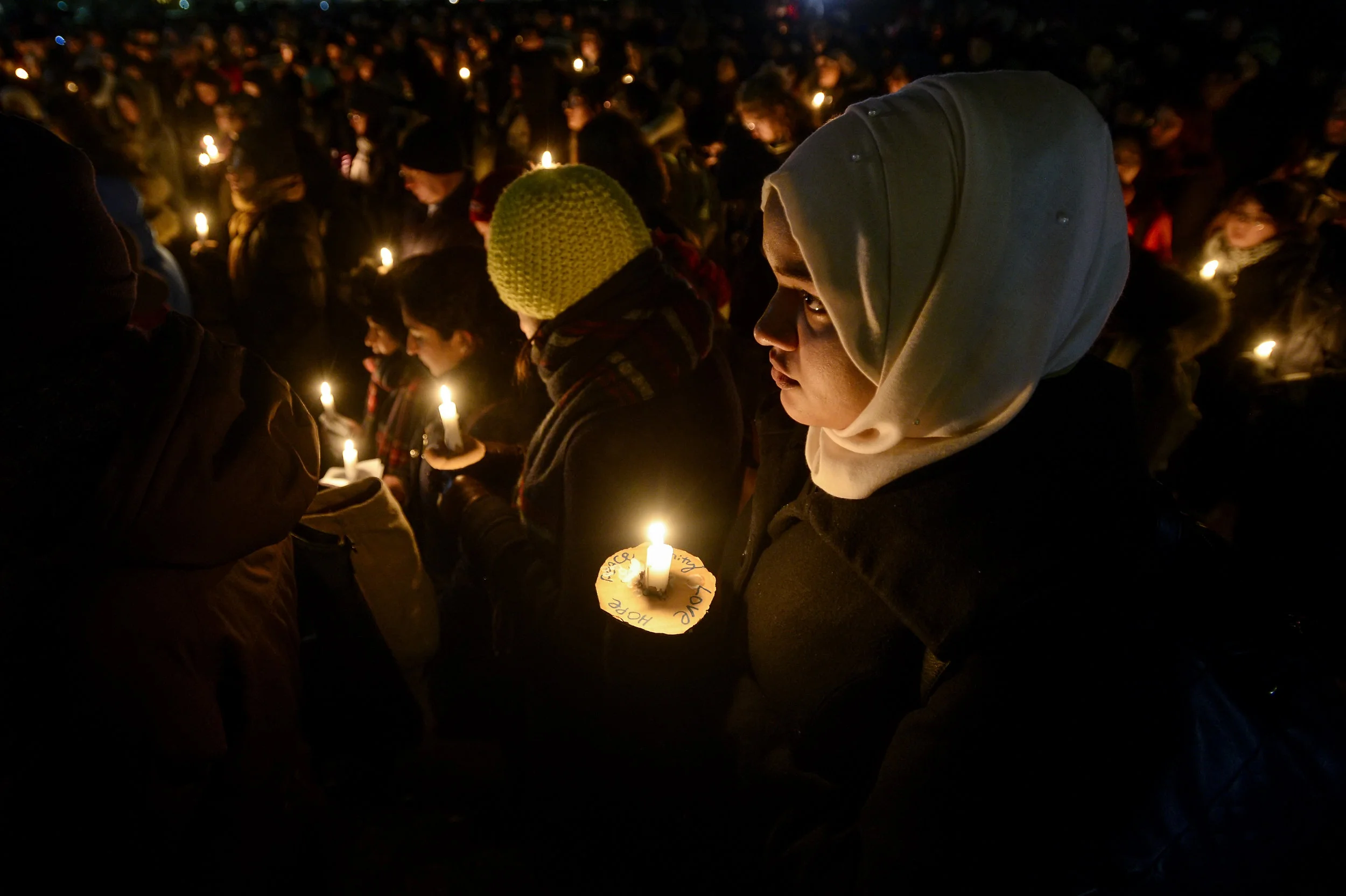  Noshin Chowdhury, 19, listens to a spoken word artist during a vigil held at the University of Toronto for the 6 victims killed after a shooting at a Quebec City mosque. Hundreds of people gathered at King's College Circle at the University of Toron