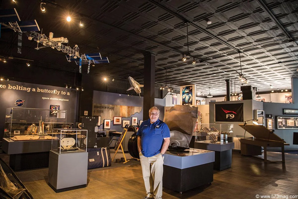 Earl Mullins with artifacts in the Grissom Center .