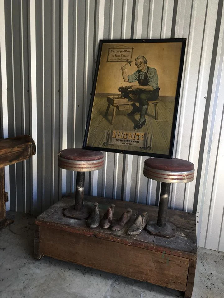 Original Shoe Shine stand from the cell barn in El Dorado, Kansas Cobbler molds & Vintage posters