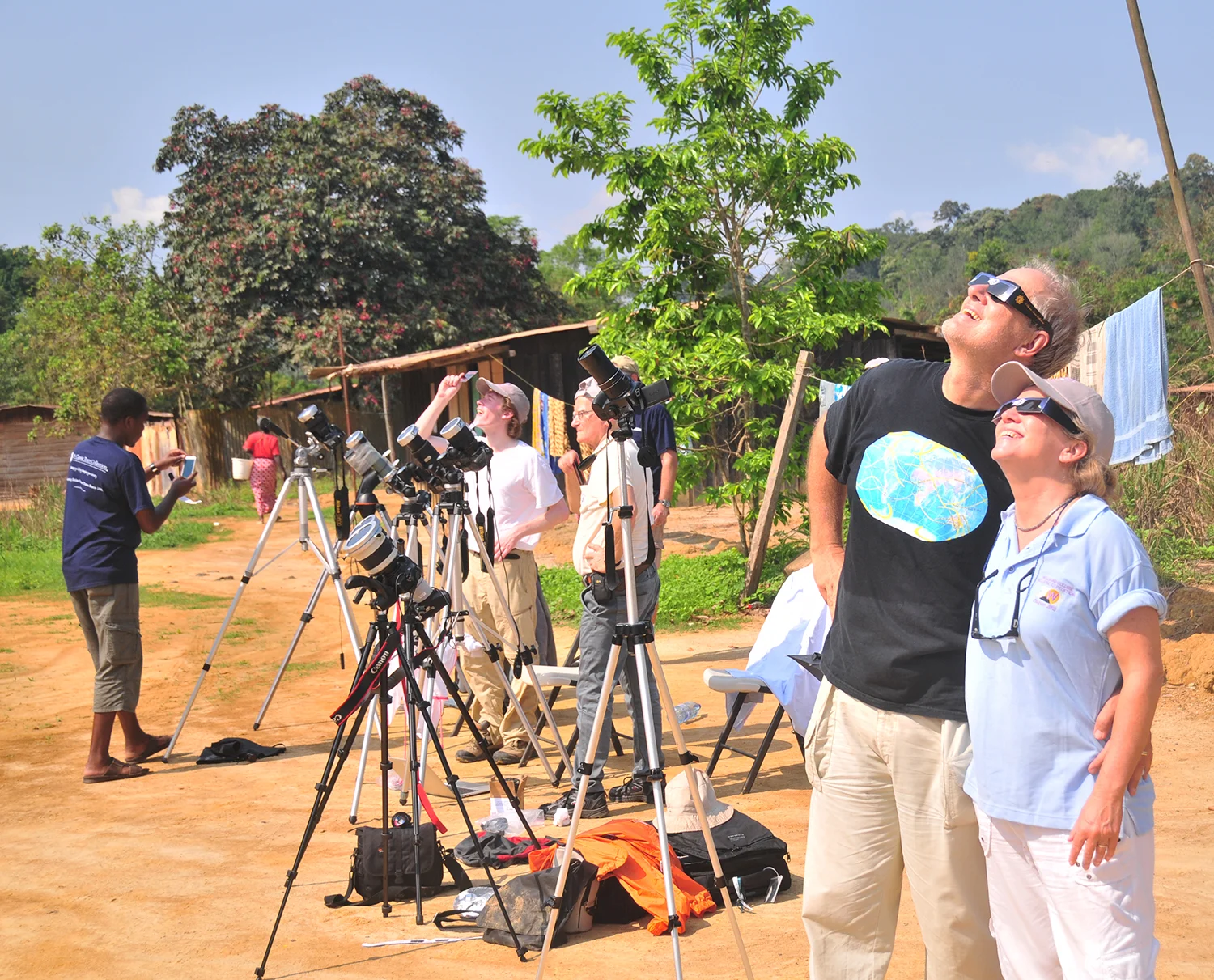 Safely viewing the partial phase of the solar eclipse with eclipse glasses in Gabon, Africa, November 2013. @2013 Michael Zeiler.
