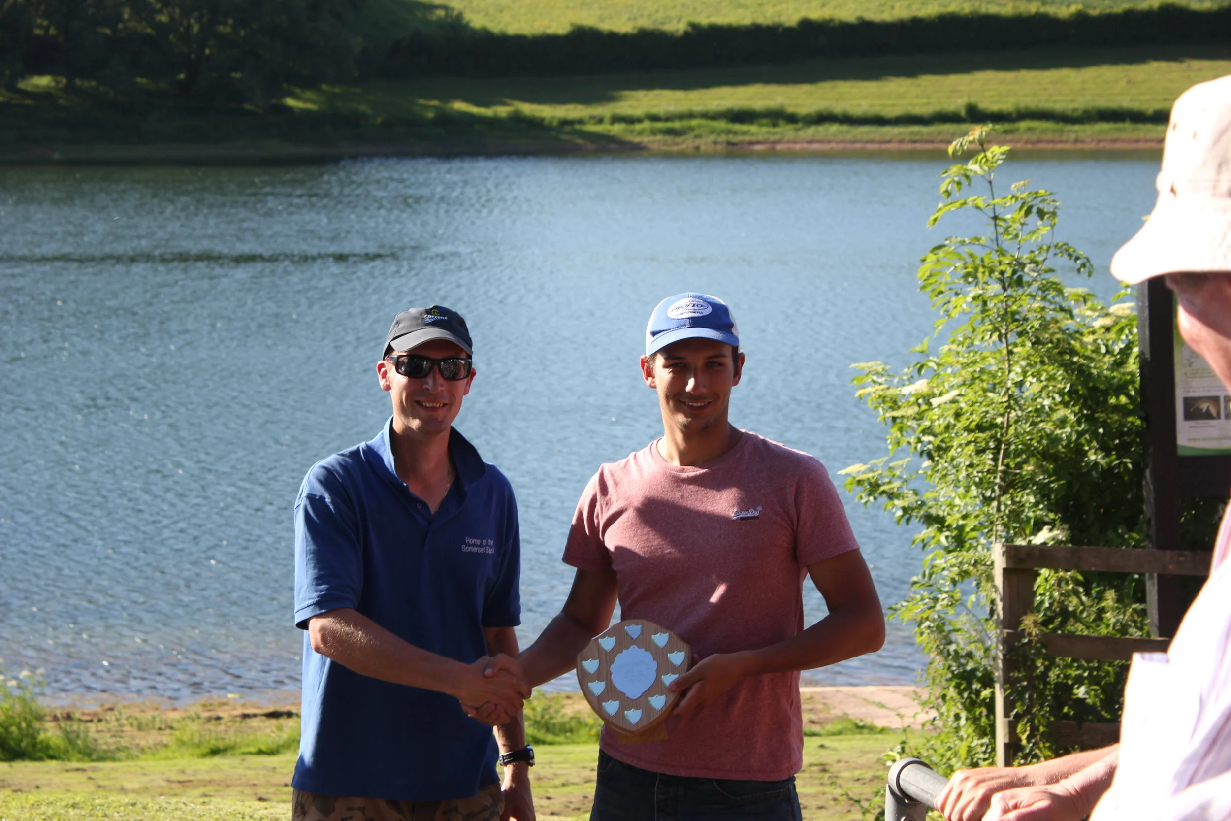 Jake receiving the much coveted Torre trout farms shield. 
