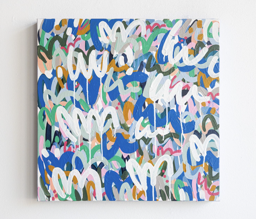Abstract colorful painting with various brushstrokes in shades of blue, green, pink, white, orange, and gray on a canvas mounted on a white wall.