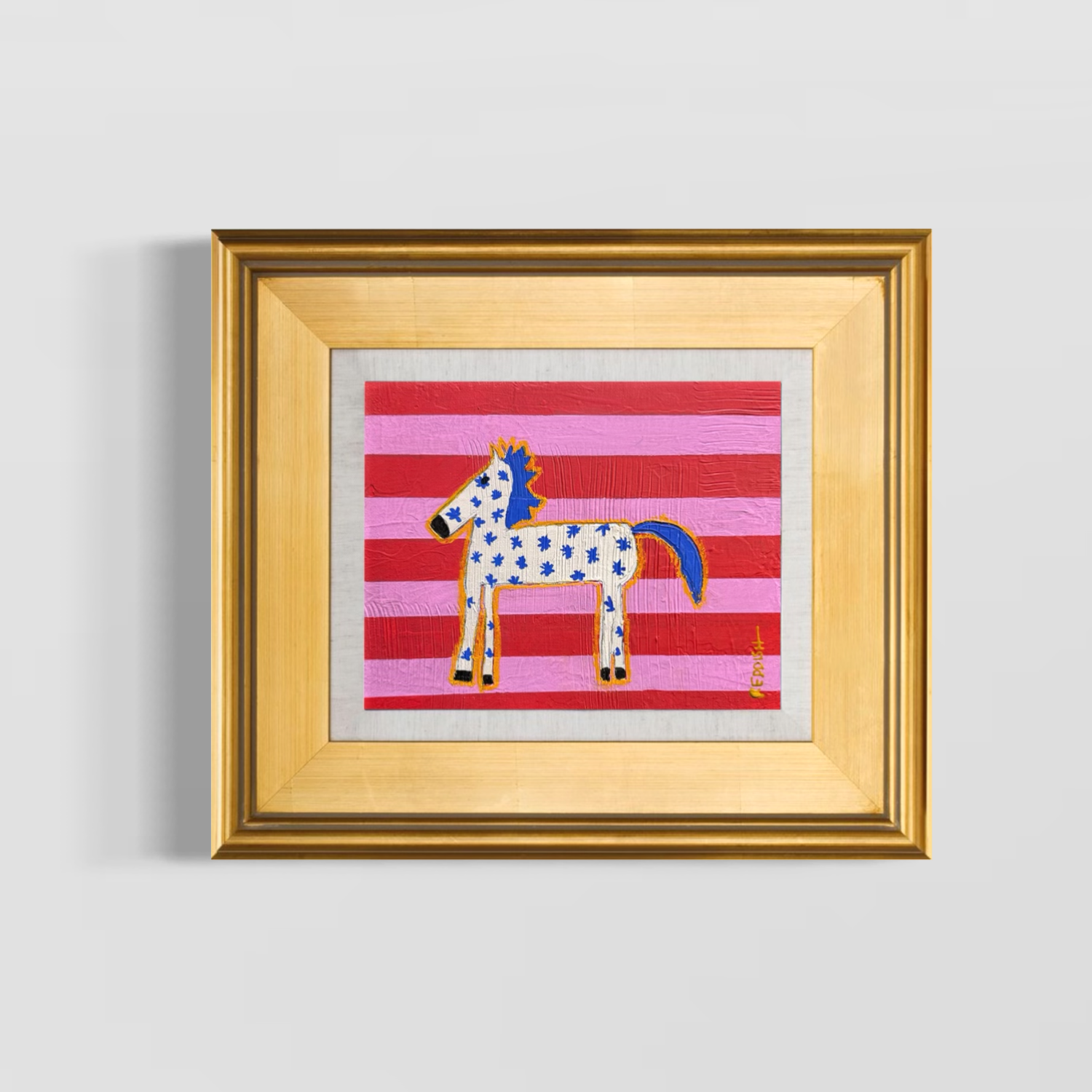 Colorful artwork of a cartoon-style horse with blue spots, orange outlines, and a yellow mane on a background of horizontal pink and red stripes, framed in a wooden frame.