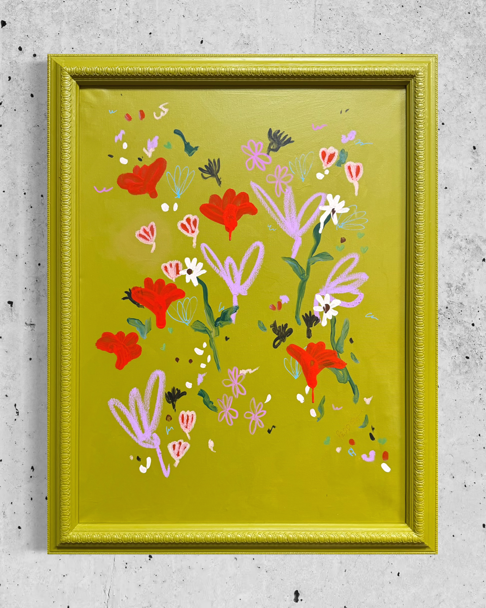 Close-up of colorful floral and butterfly artwork in a decorative yellow picture frame hanging on a concrete wall.